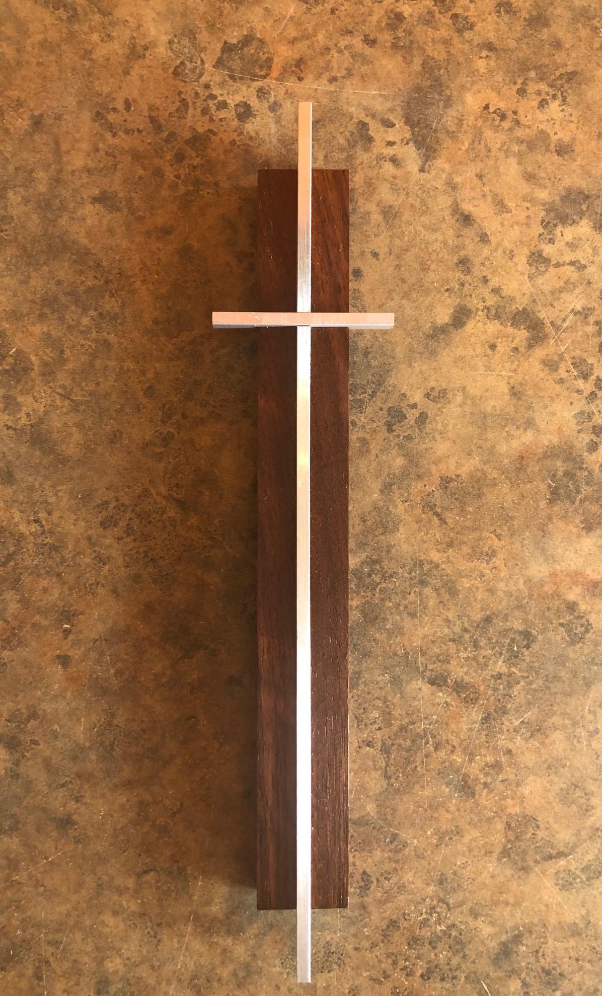 Small Minimalist walnut and aluminum crucifix / cross, circa 1960s. The piece measures 8.5