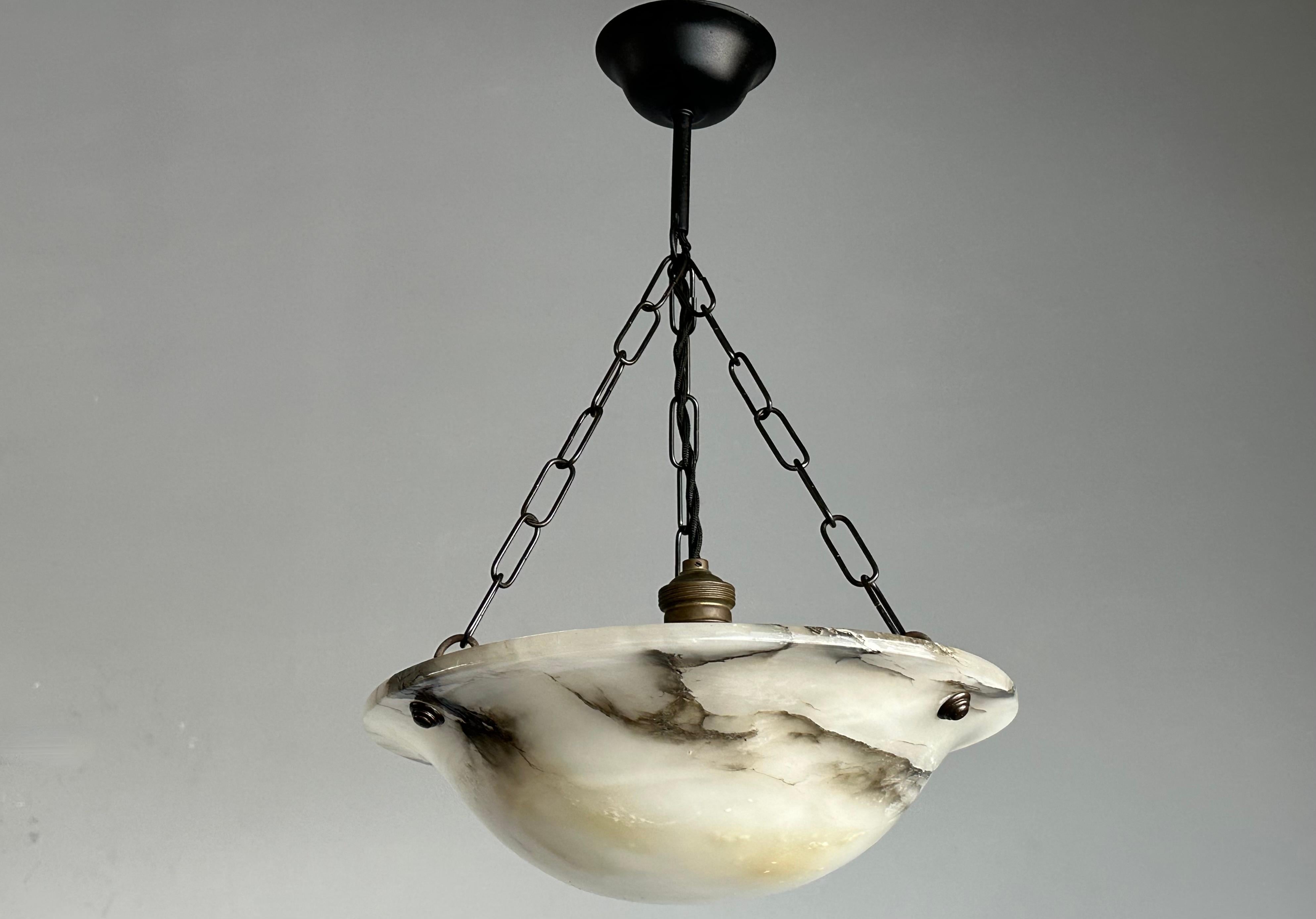 Small and truly timeless Art Deco chandelier that will never fail to impress.

With early 20th century lighting as one of our specialties, finding an excellent condition and highly attractive fixture always makes our day. This small size specimen