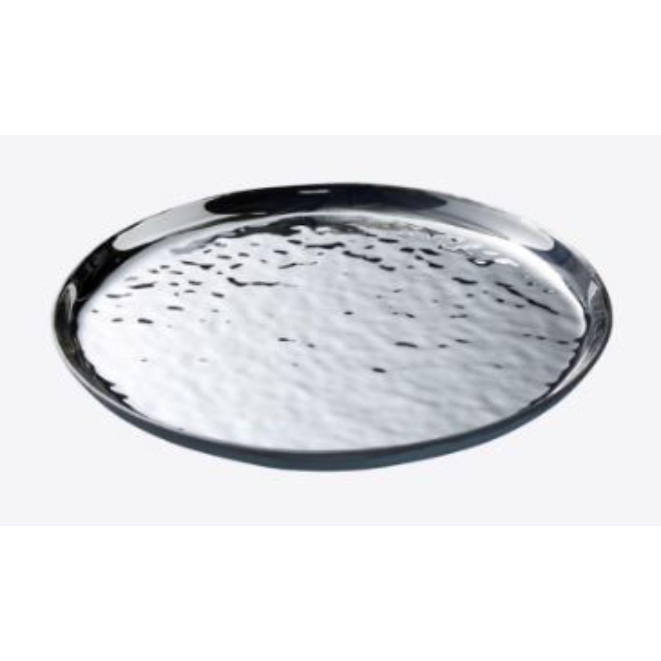 Small Mirage round tray by Radar
Design: Bastien Taillard
Materials: glass.
Dimensions: D 35 x W 35 x H 3 cm
Available in silver, gold or Iris finish.

Elegant, timeless, understated. The RADAR collection allows you to take a welcome break