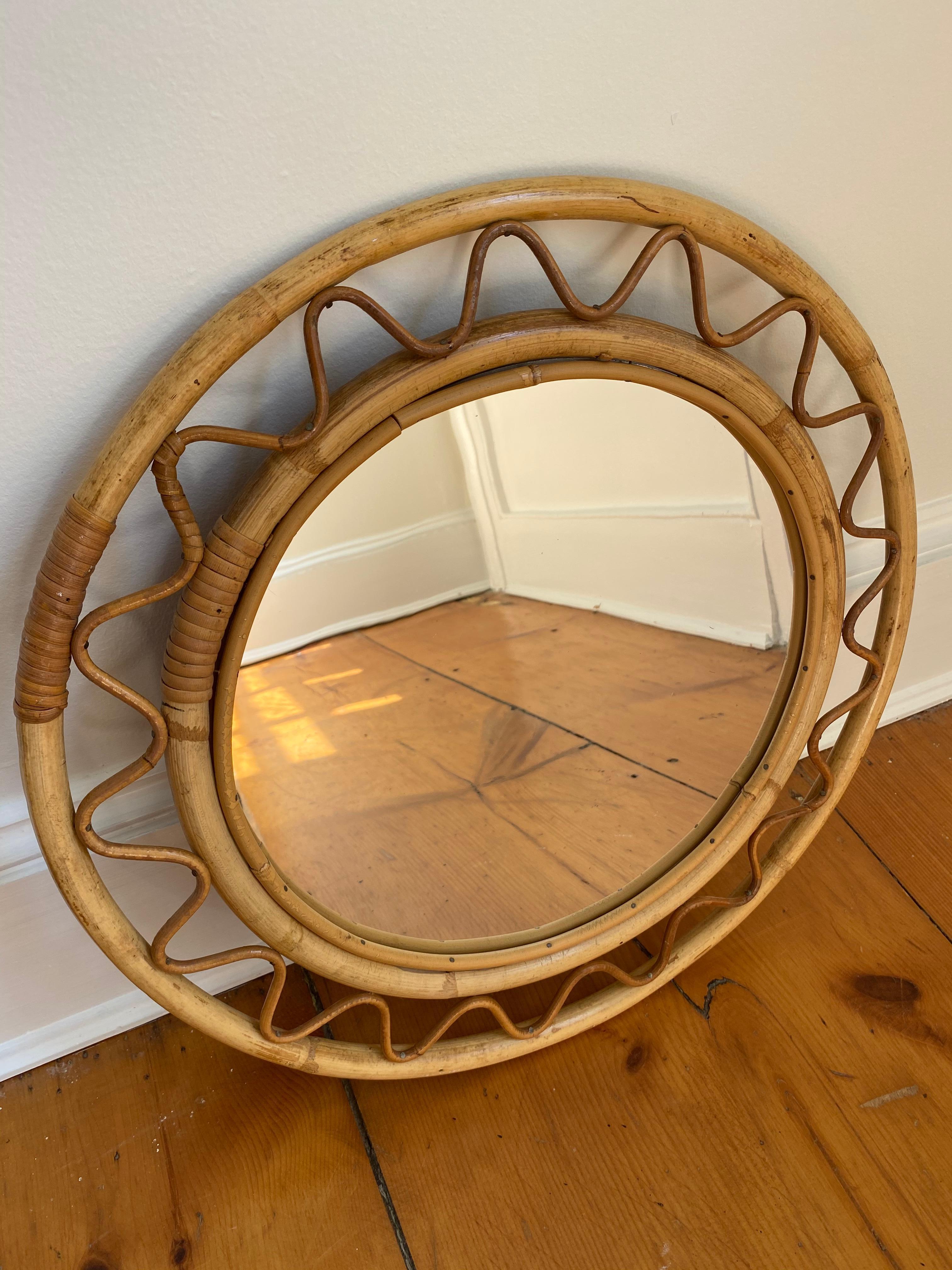 A rattan mirror attributed to Josef Frank for Svenskt Tenn

Sweden, midcentury

Measure: Diameter 17 1/8