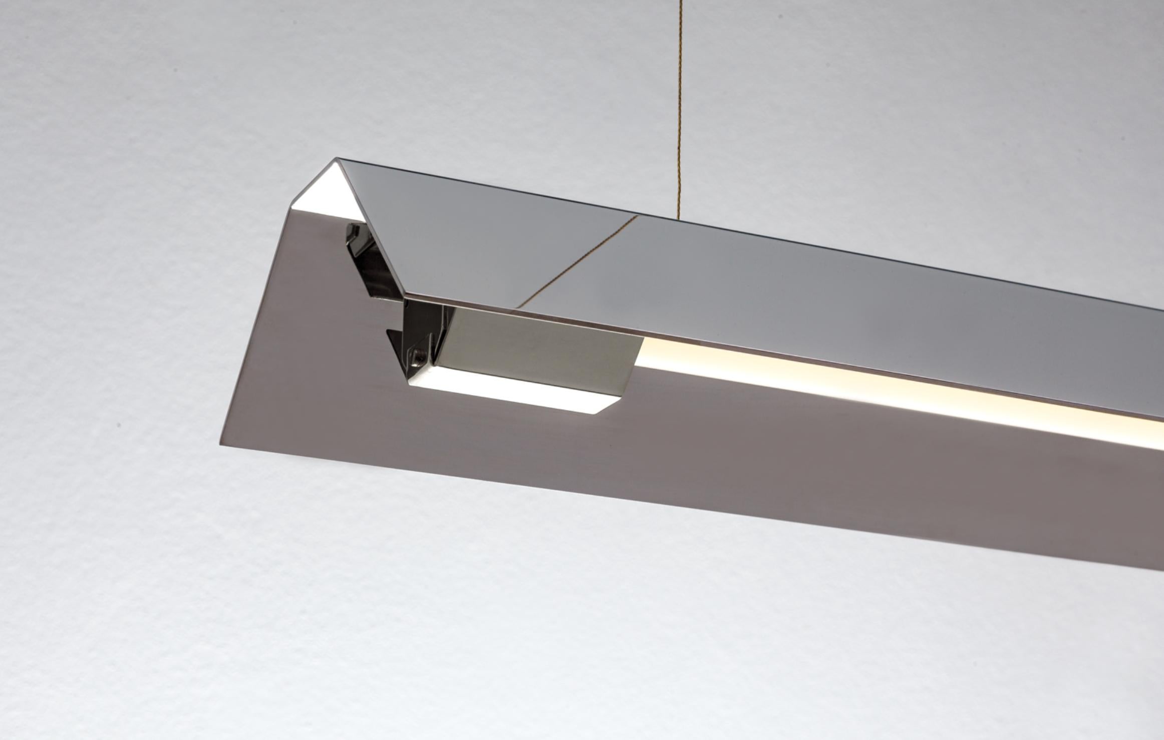 Small Misalliance inox suspended light by Lexavala
Dimensions: D 16 x W 70 x H 8 cm
Materials: Stainless steel.

There are two lenghts of socket covers, extending over the LED. Two short are to be found in Suspended and Surface, and one long in