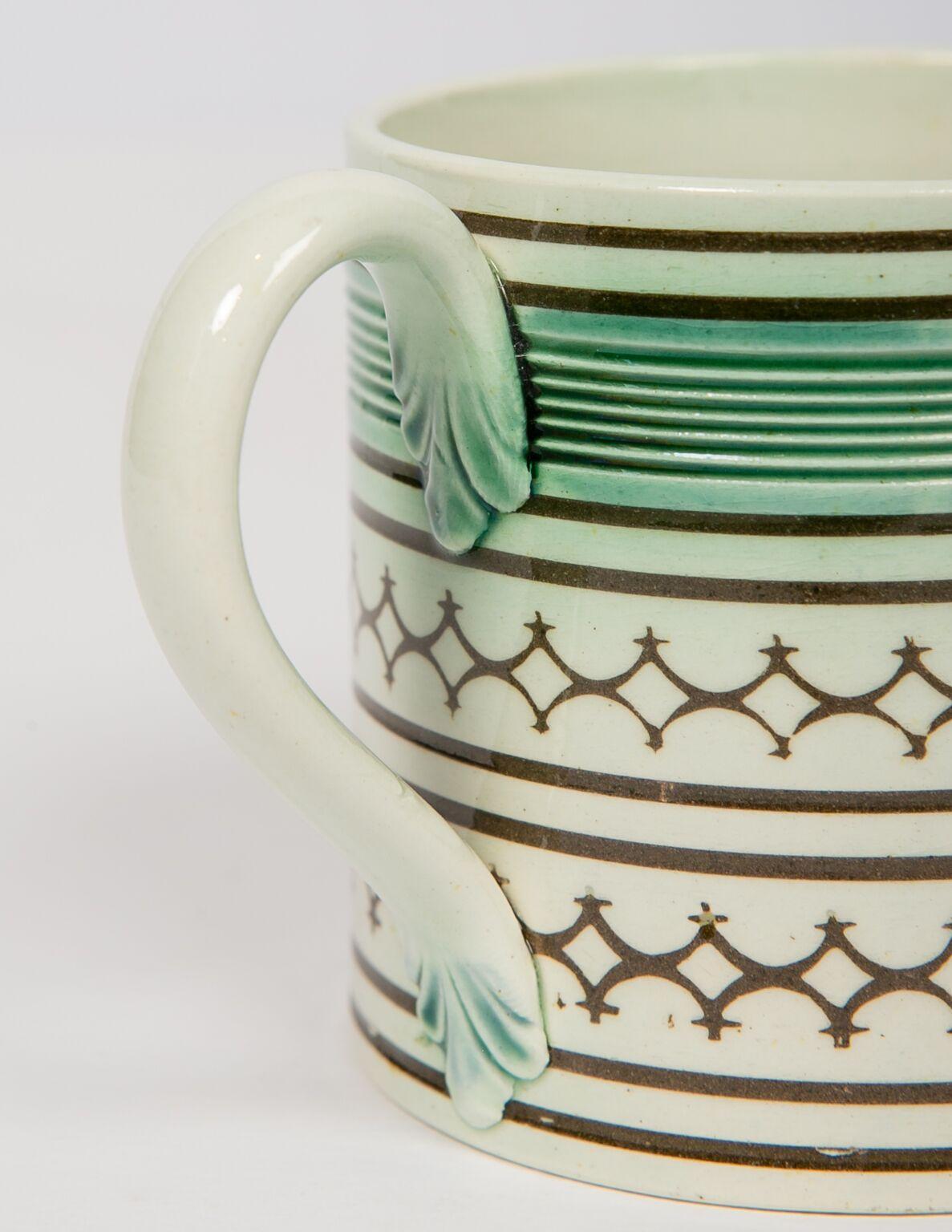 Small Mochaware mug England, circa 1820
Decorated with rouletted and green glaze decoration above two rows of inlaid rouletting black diamonds.
Dimensions: Diameter 2.5