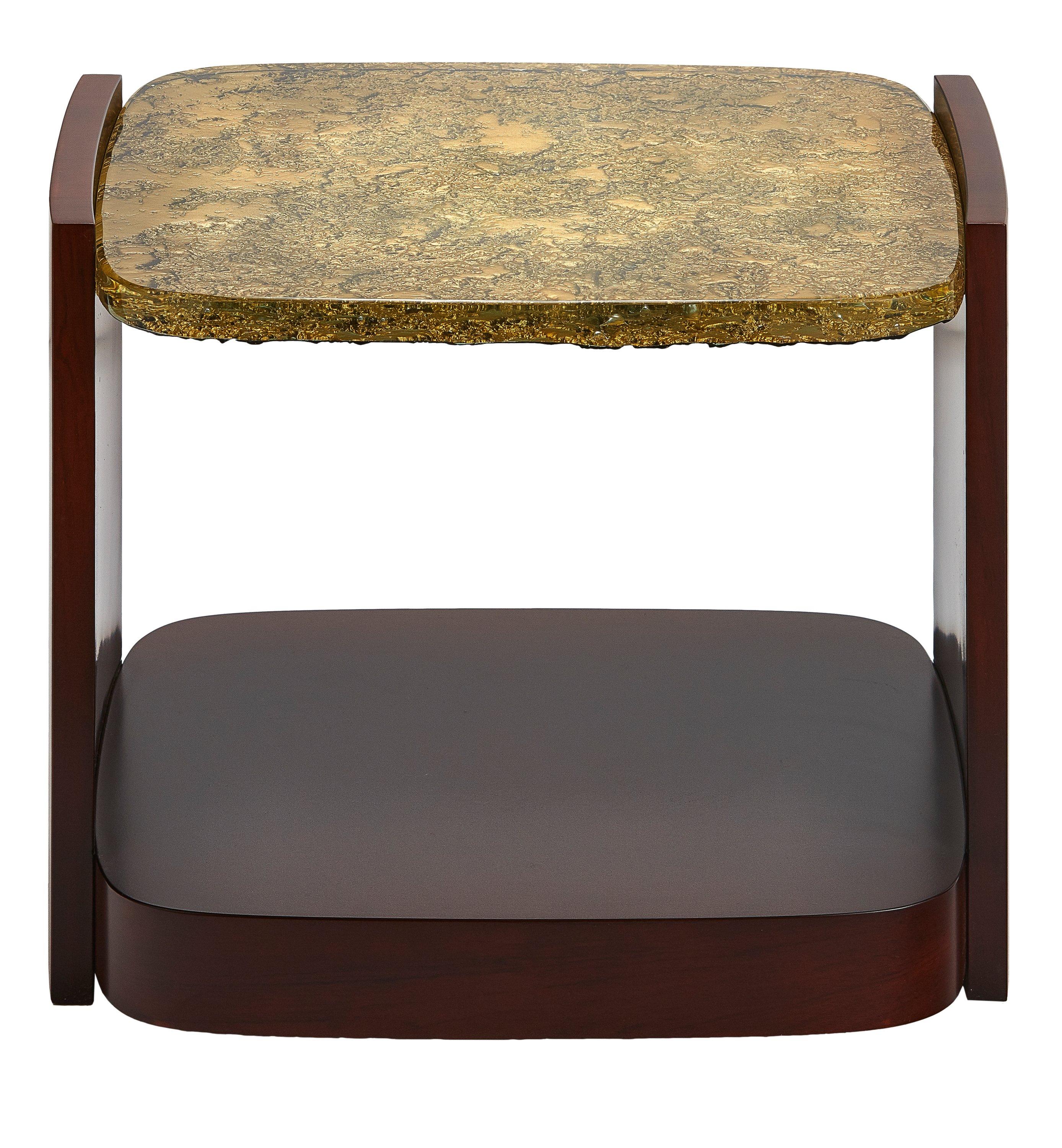 The modern stylish rectangle-shaped table finished with dark Merbau wood veneer and 1” thick cast glass top in goldish tint. The back-side of the sculptured glass slab is metalized to expose the decorative texture.
