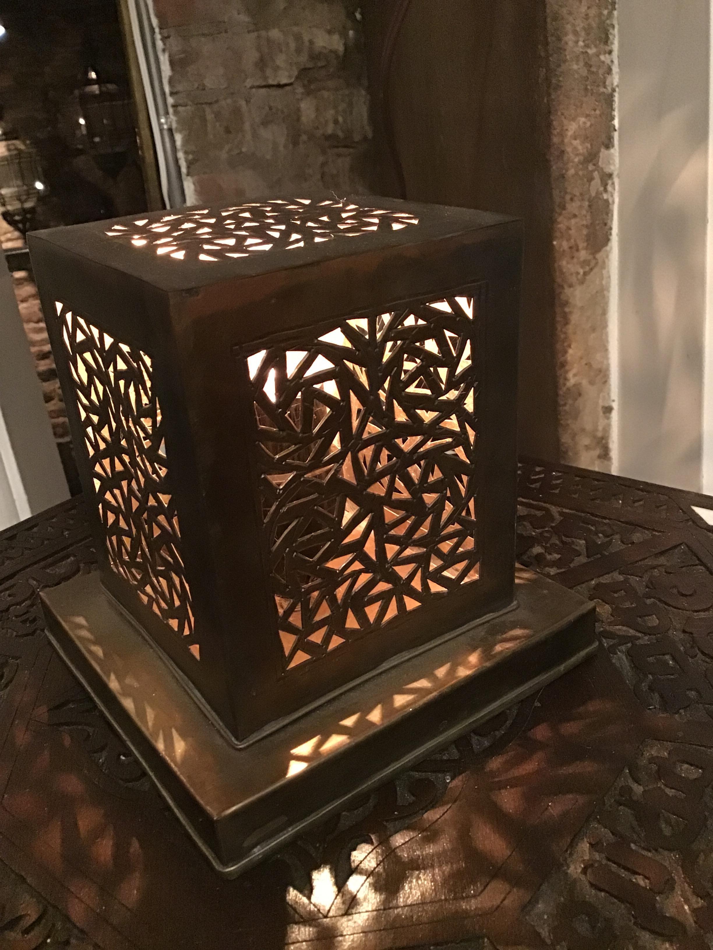 Beautifully detailed brass table lamp in a modern geometric shape.