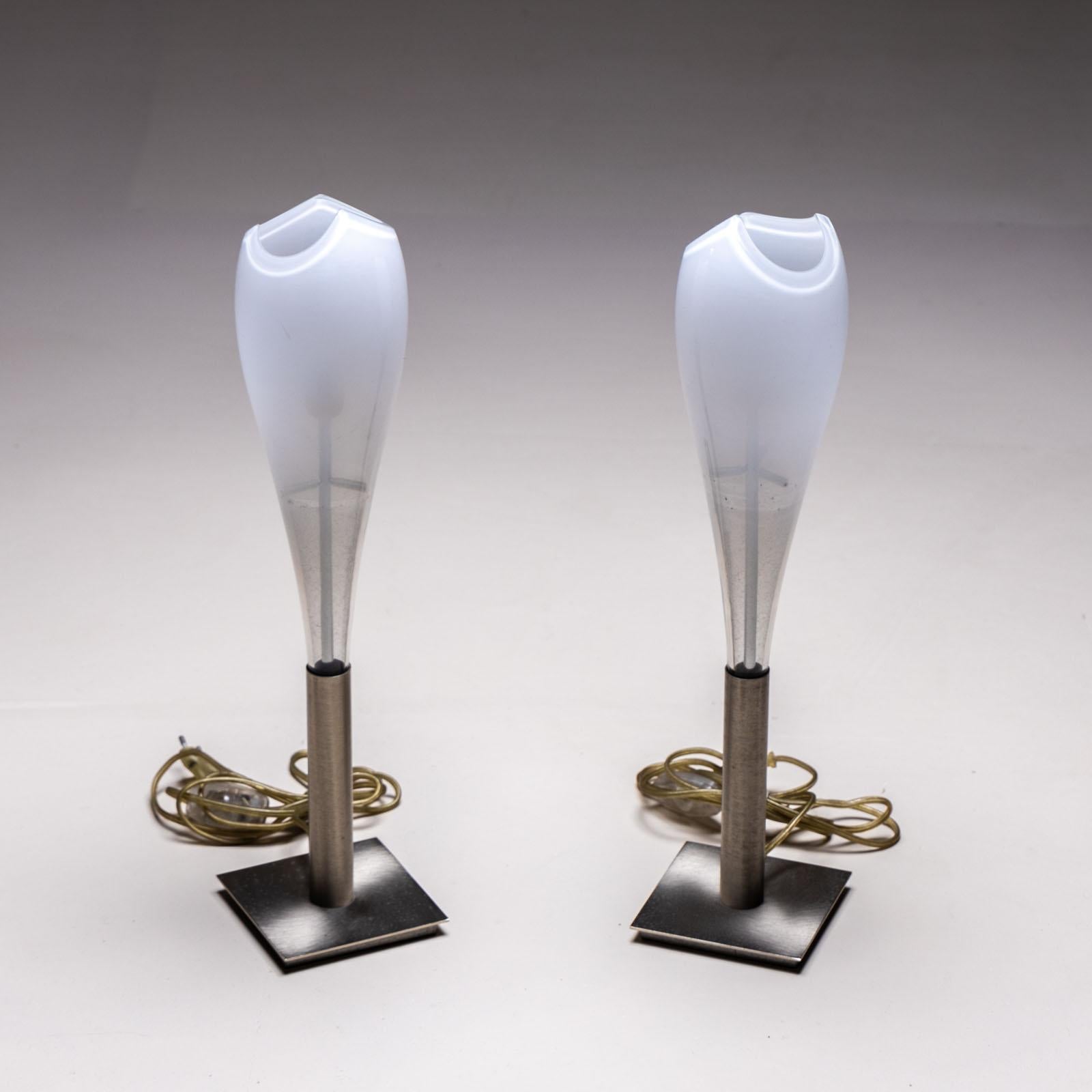 Pair of petite table lamps featuring white Murano glass shades in a teardrop design, complemented by nickel-plated bases. These lamps retain their original wiring and are marked with the label 