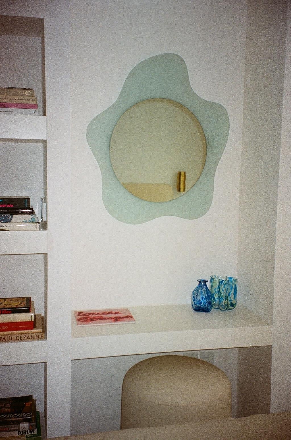 Italian wall mirror with blue crystal glass by Nando Vigo, 1980s.
Italian designer Nanda Vigo started her own atelier in Milan in 1959, and soon after began to exhibit her designs in many galleries and museums around Italy and Europe. She later