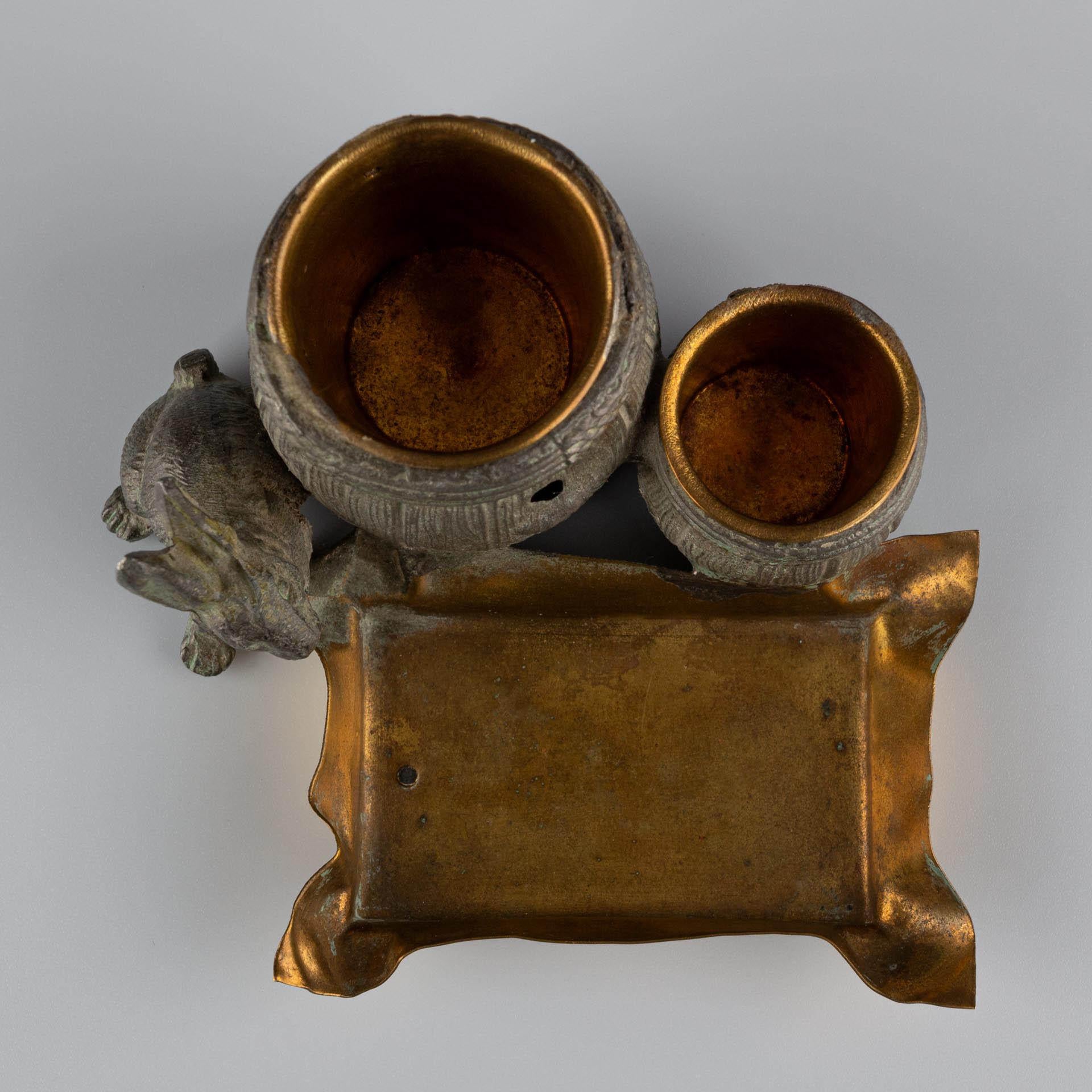 Small naturalistic desk set with rabbit and barrels made of patinated metal For Sale 7