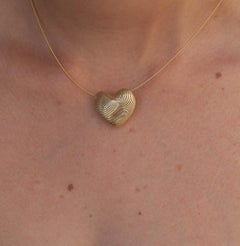 18 Karat Yellow Gold Small Netline Heart Pendant.
