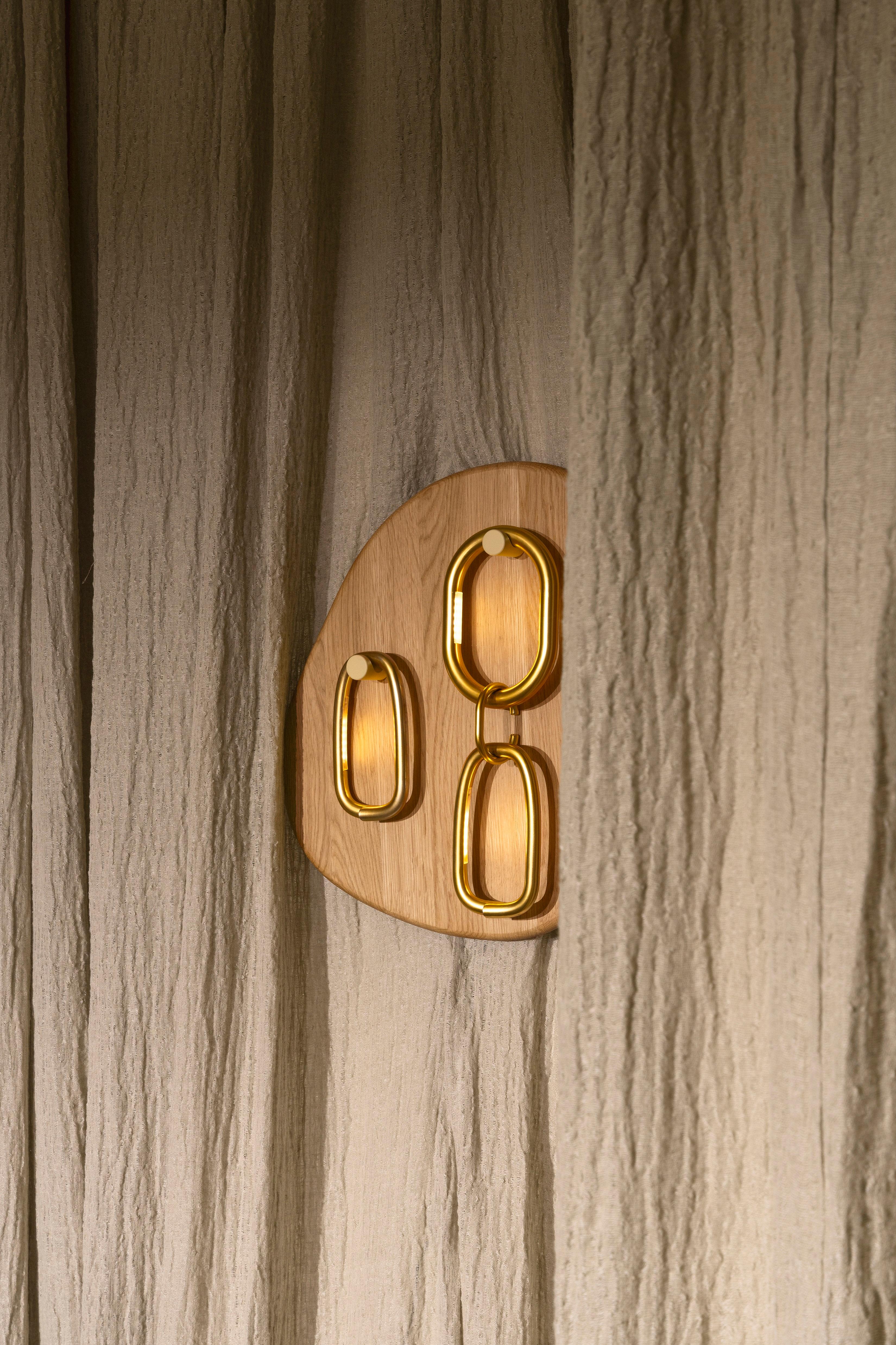 Small Notearrings Oak Wall Lamp by Virginia Arlotto
Dimensions: D 10 x W 47.5 x H 56,3 cm. 
Materials: Natural oak, metal, resin.

Available in small and medium. Please contact us.
Available in different wood and metal finishes.

All our lamps can