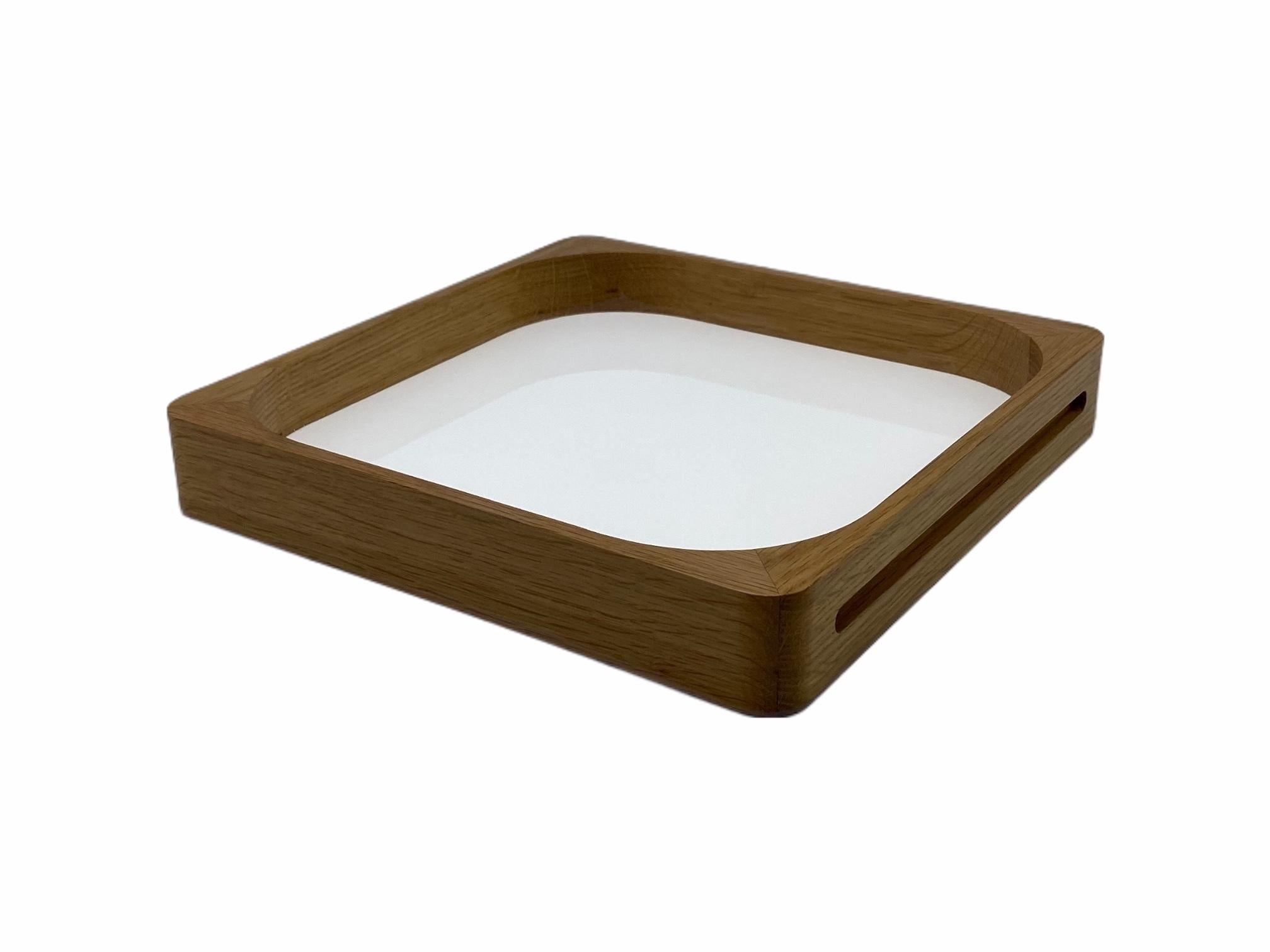 This classic, yet modern, craftsmanship based tray is made out of Oak wood and acrylic and was designed by GS in 2004. It can be used by clients as a cocktail tray as well as a very modern and practical serving tray, making it the perfect gift. The