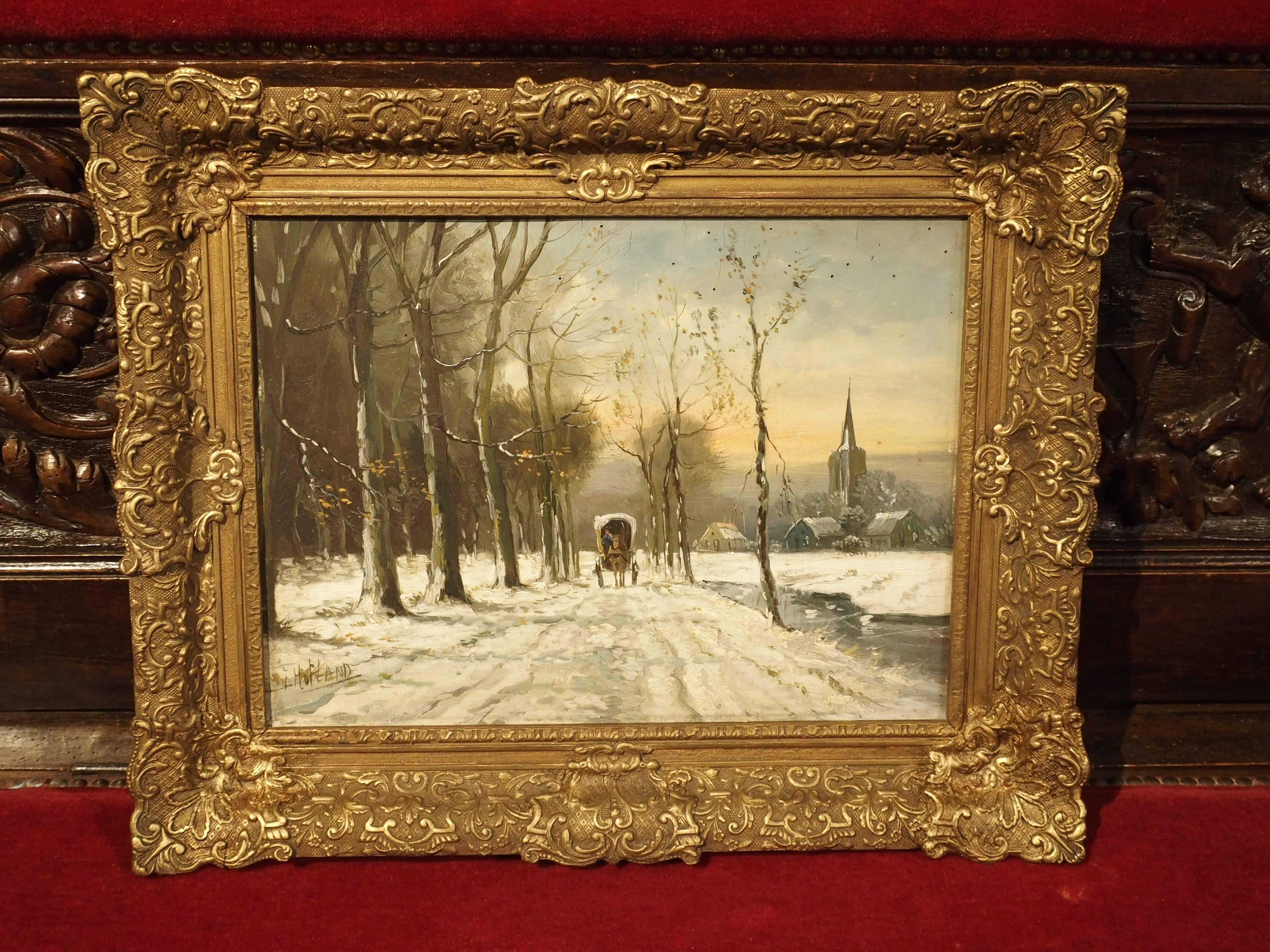 This small framed oil painting on board was done by Jan Hofland sometime in the 20th century. It depicts a wonderful winter scene of a covered horse drawn carriage traveling down a snowy, tree lined path. To the right of the path is a church with a