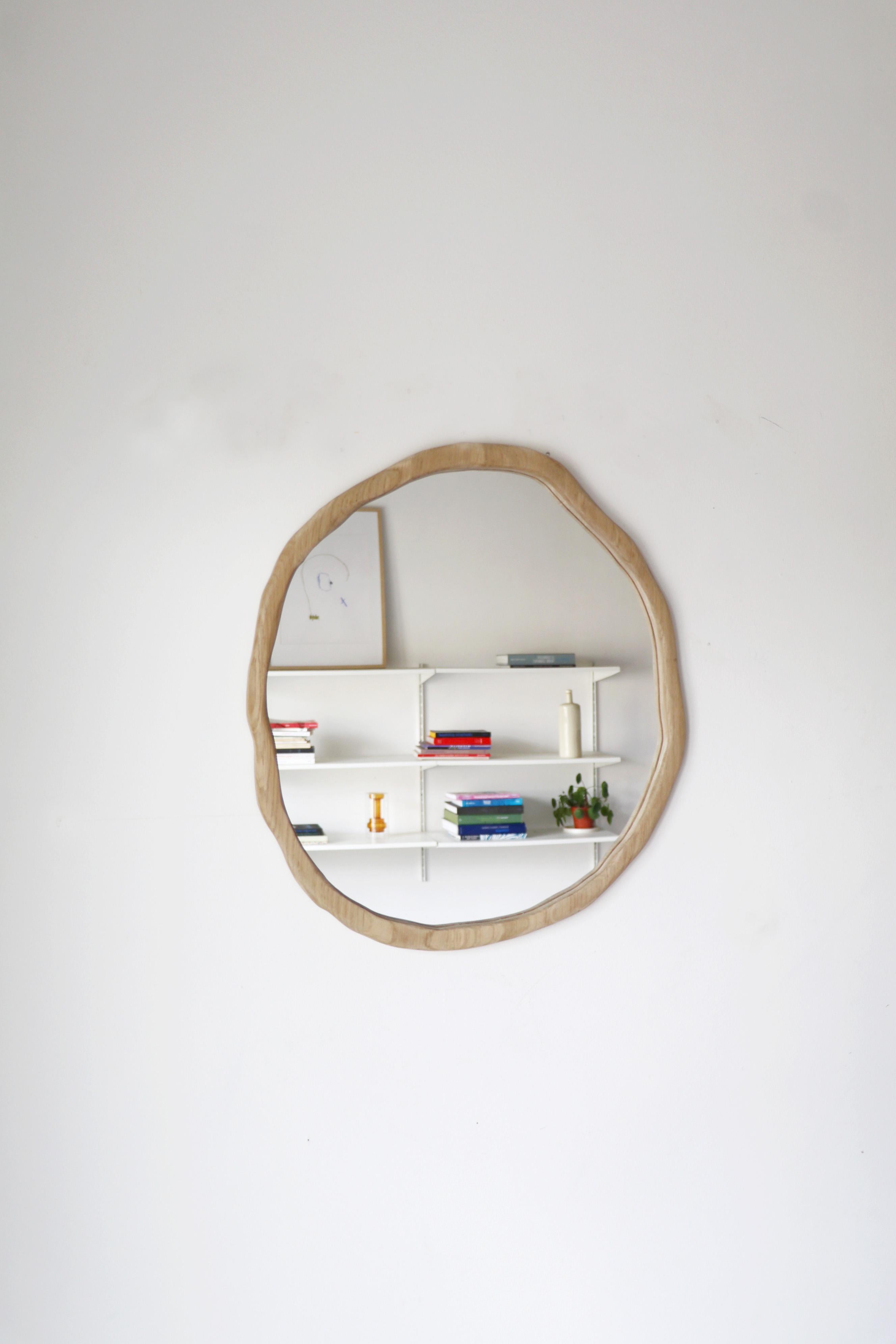 Small ondulation mirror by Alice Lahana Studio
One of a kind.
Dimensions: Ø 45 x H 50 cm.
Materials: Light oak.
Available finishes: Dark and light varnish. 

Every mirror is unique. The shape slightly varies from edition to edition. Please