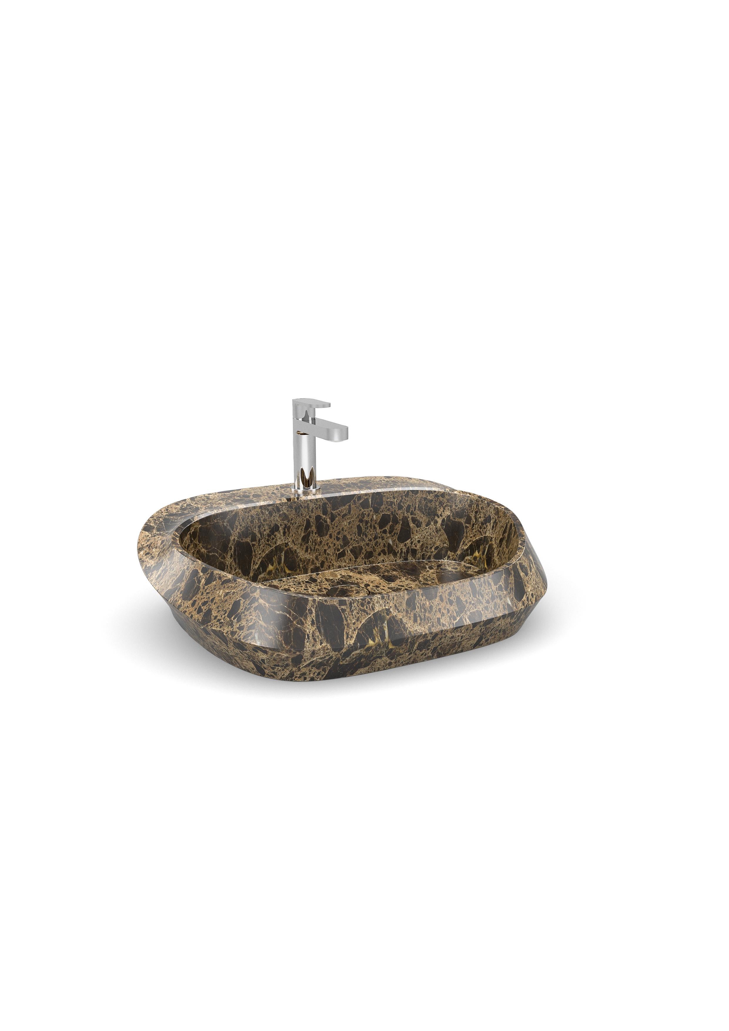 Small Opera Tosca washbasin by Marmi Serafini
Materials: Emperador Brown marble.
Dimensions: D 44 x W 58 x H 17 cm
Available in other marbles.
Tap not included.

Tosca is a magnificent washbasin made of a single solid piece of marble.
The large