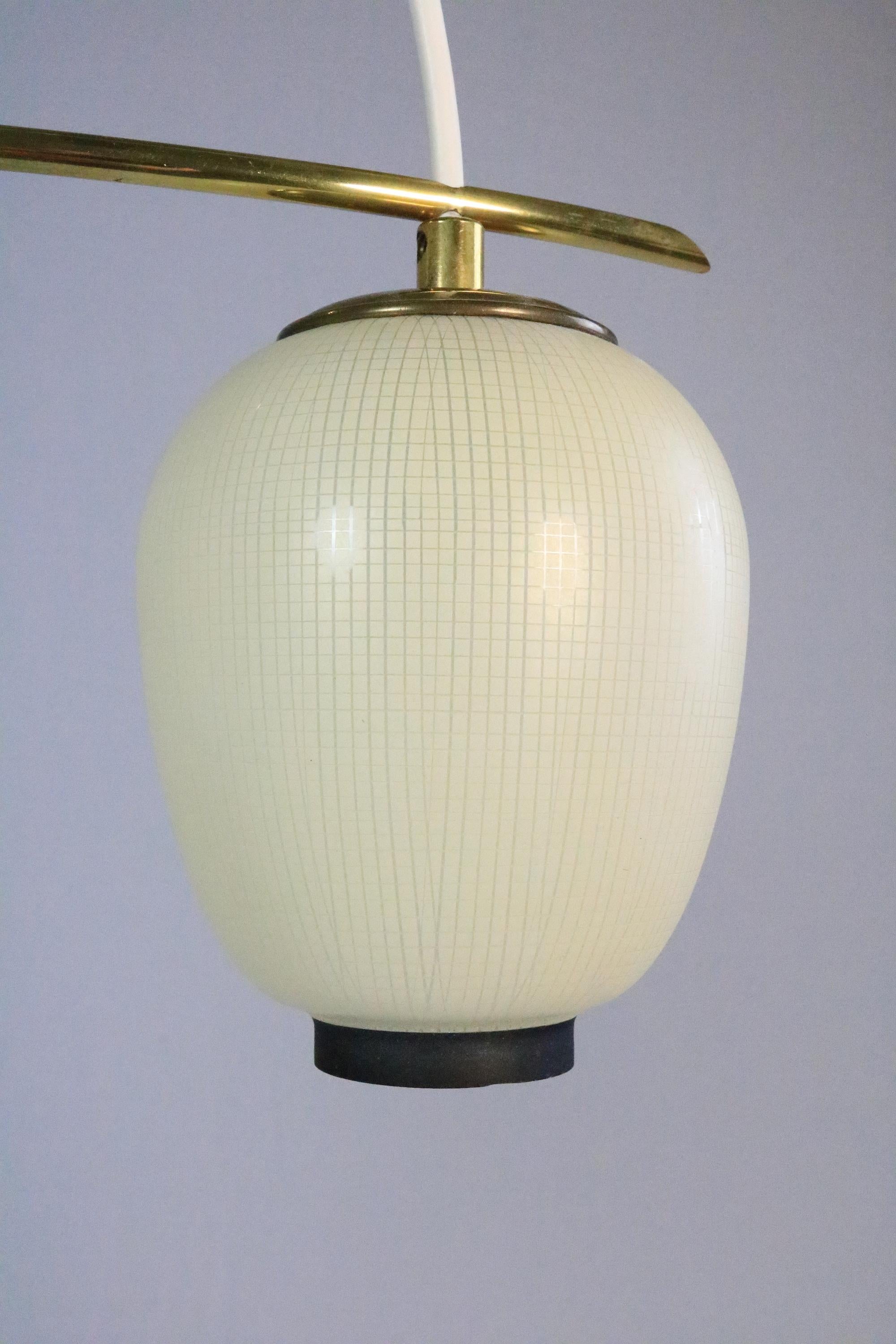 This very delicate and small, but no less effective hanging lamp consists of two lampion-like glass shades, which are held apart by a brass rod.
Asia Style.

Manufacturer: DORIA Leuchtenwerke
Model Mikado (handed down)

Dimensions
Total diameter: 35