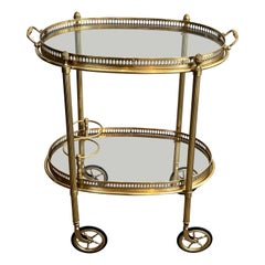 Small Oval Brass Rolling Table with Double Removable Tops from Maison Bagués