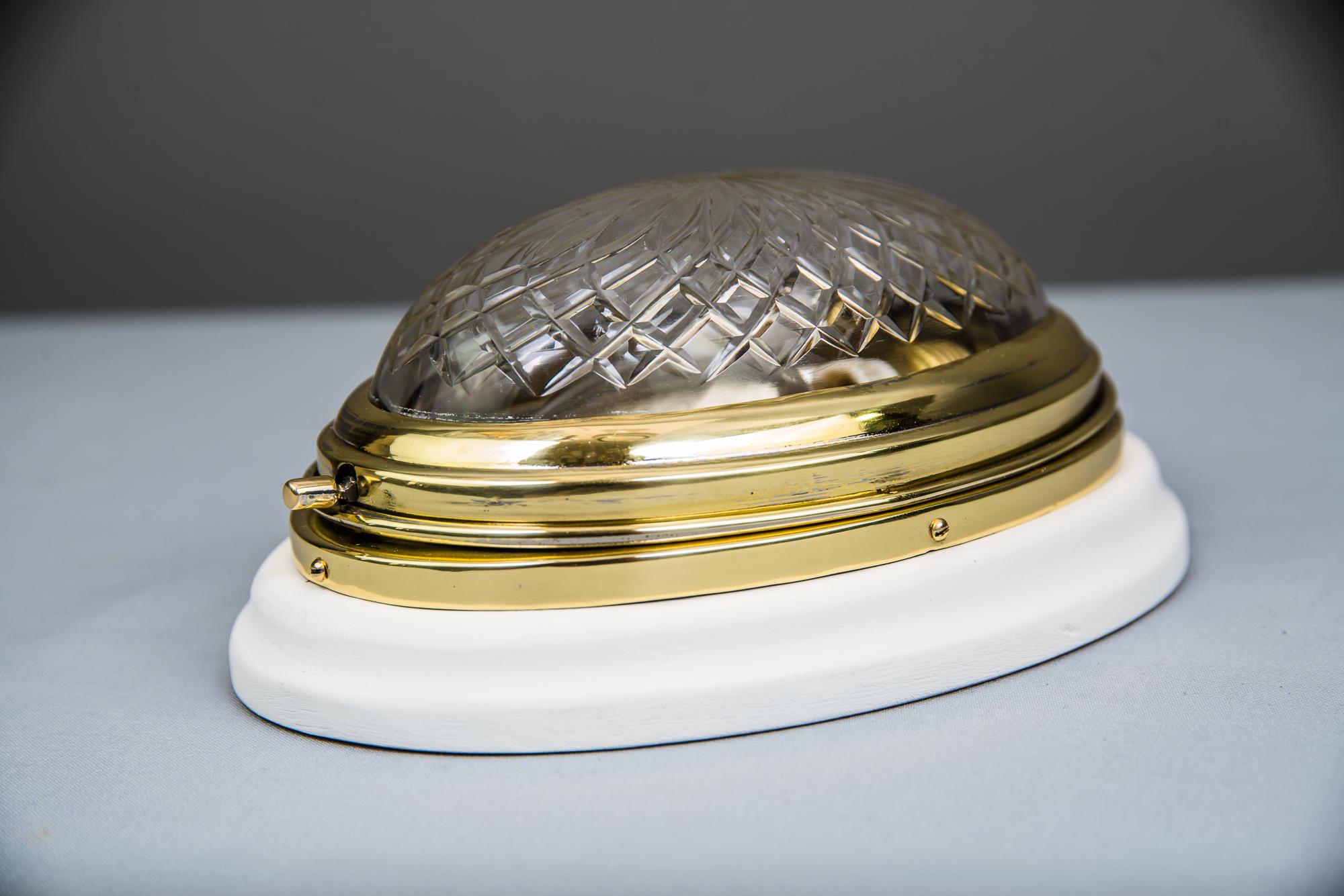 Lacquered Small oval ceiling or wall lamp with white wood plate and cut glass around 1920s