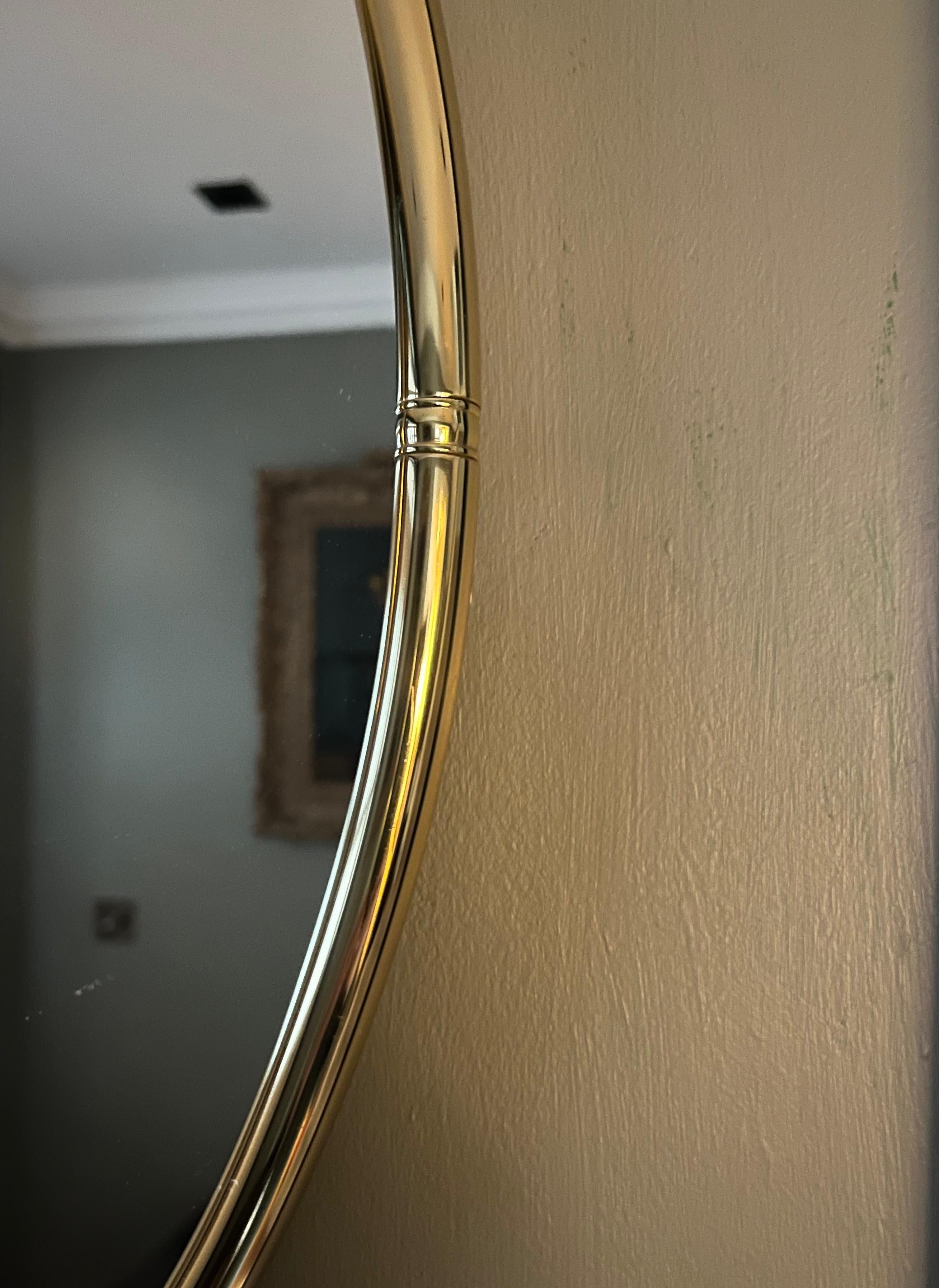 Mid-Century Modern Small oval gilt metal mirror