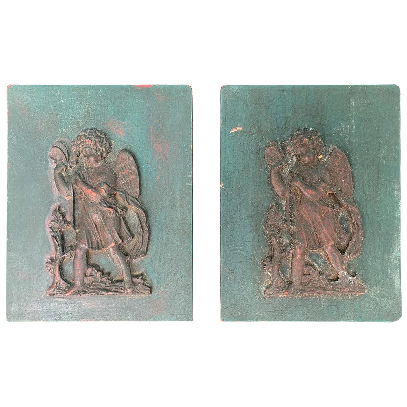 Small Pair of 19th-20th Century Carved Wooden Plaques with Putti For Sale