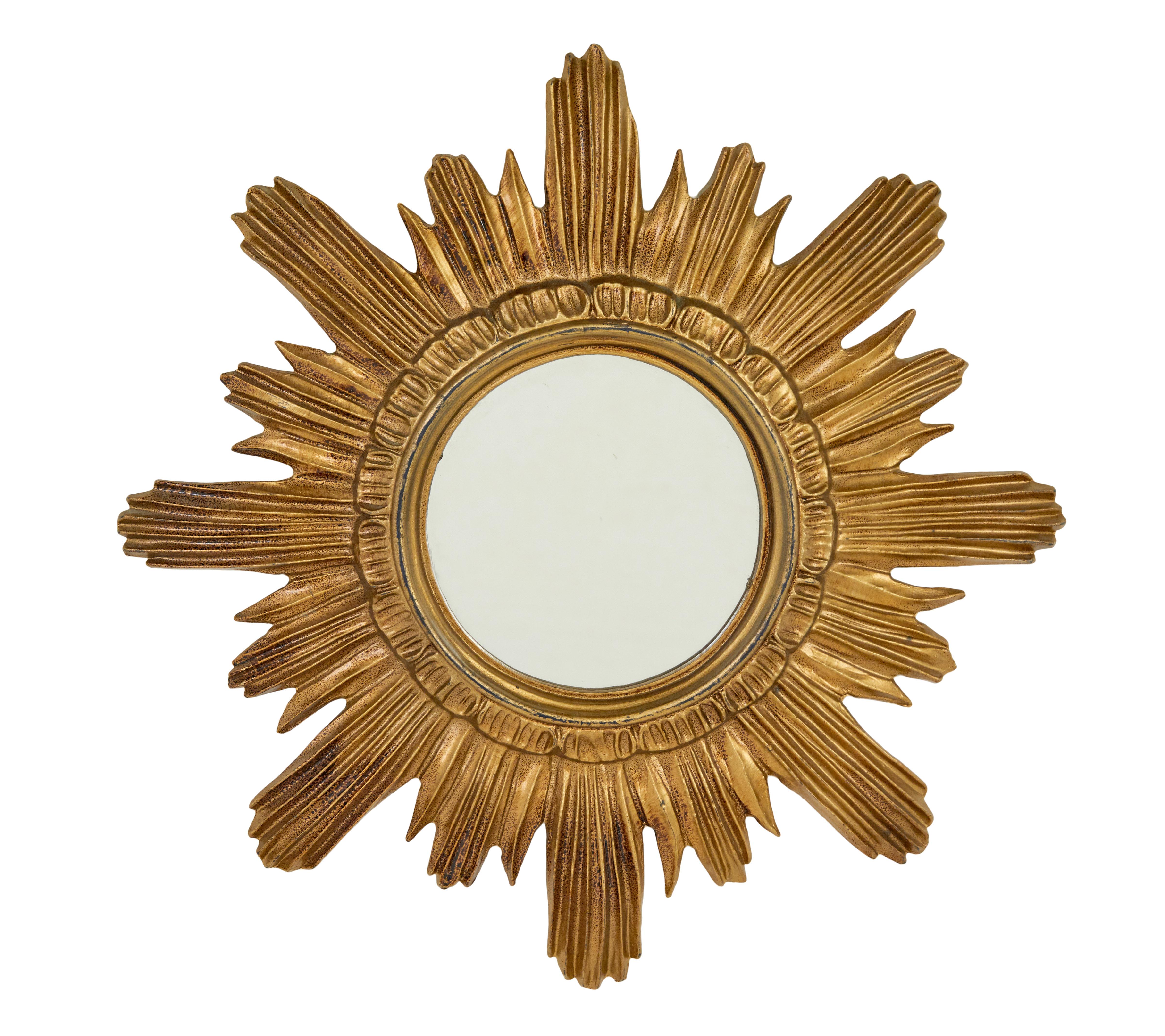 Small pair of 20th century Italian sunburst mirrors circa 1980.

Good quality matched pair of Italian made resin sunburst mirrors in the art deco style.

Symmetrical design with a central round mirror, painted gilt effect.  Ideal for use in a cloak