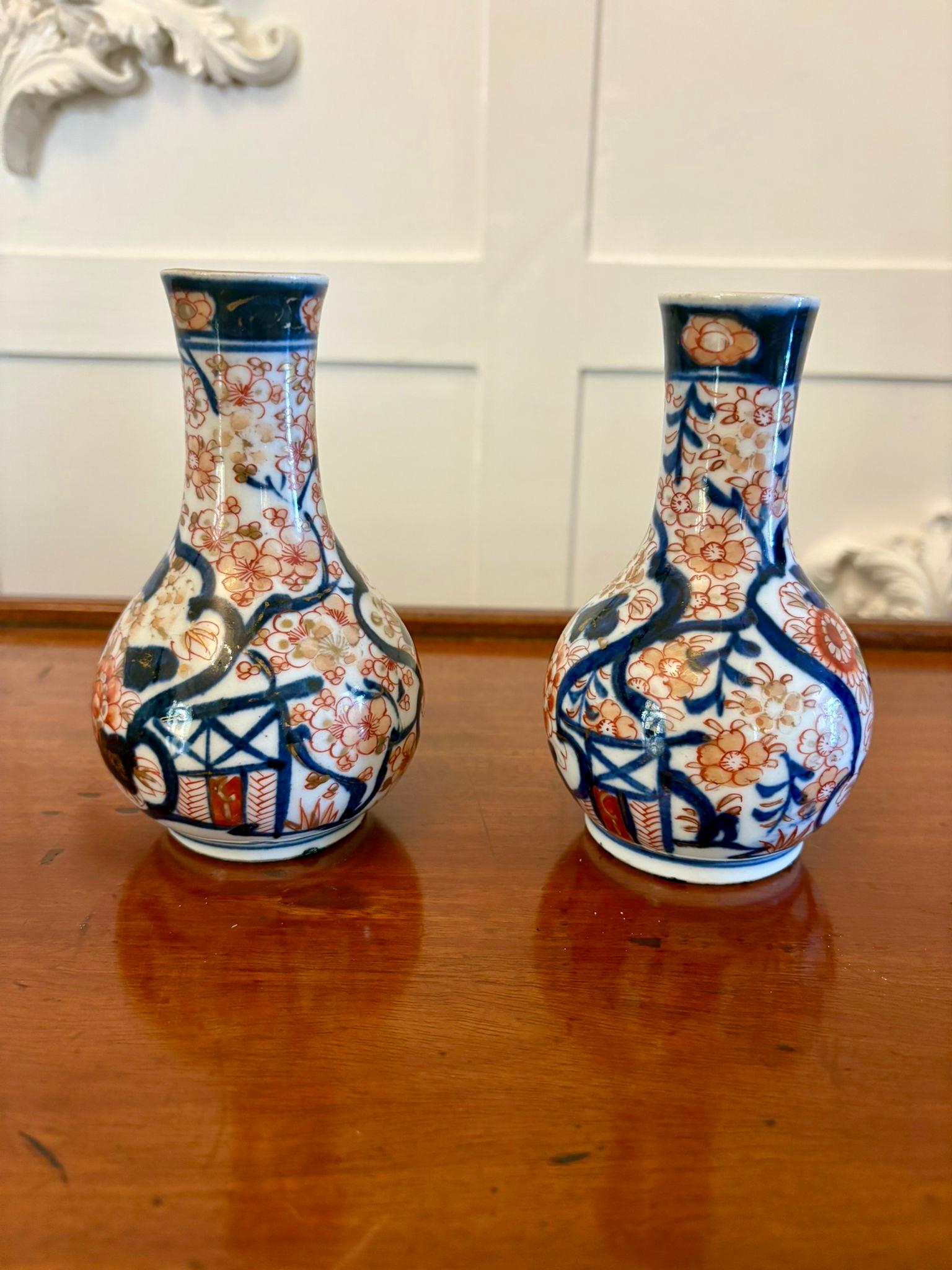 Small pair of antique Edwardian quality Japanese Imari vases having a lovely shape with wonderful hand painted panels in blue, red, white and gold colours.

Quaint and in perfect condition.

Dimensions:
Height 14 cm (5.51 in)
Width 8 cm (3.15
