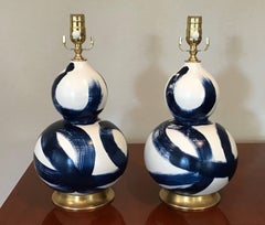 Small Pair of Blue and White Ceramic Double Gourd Shape Lamps on Gilt Bases