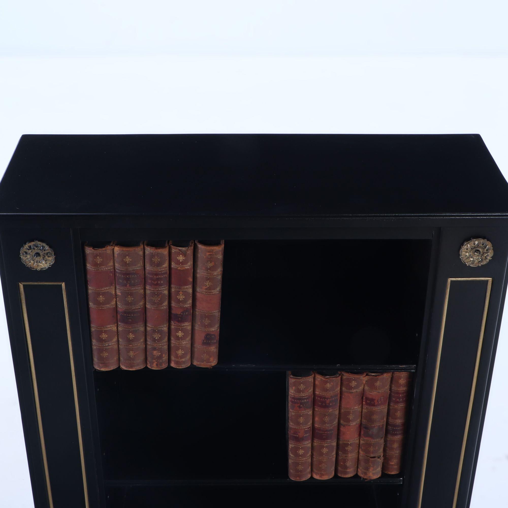 Mid-20th Century Small pair of ebonized open bookcases having bronze circa 1940. For Sale