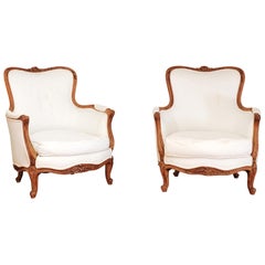 Small Pair of French 19th Century Louis XV Style Walnut Bergères with Upholstery