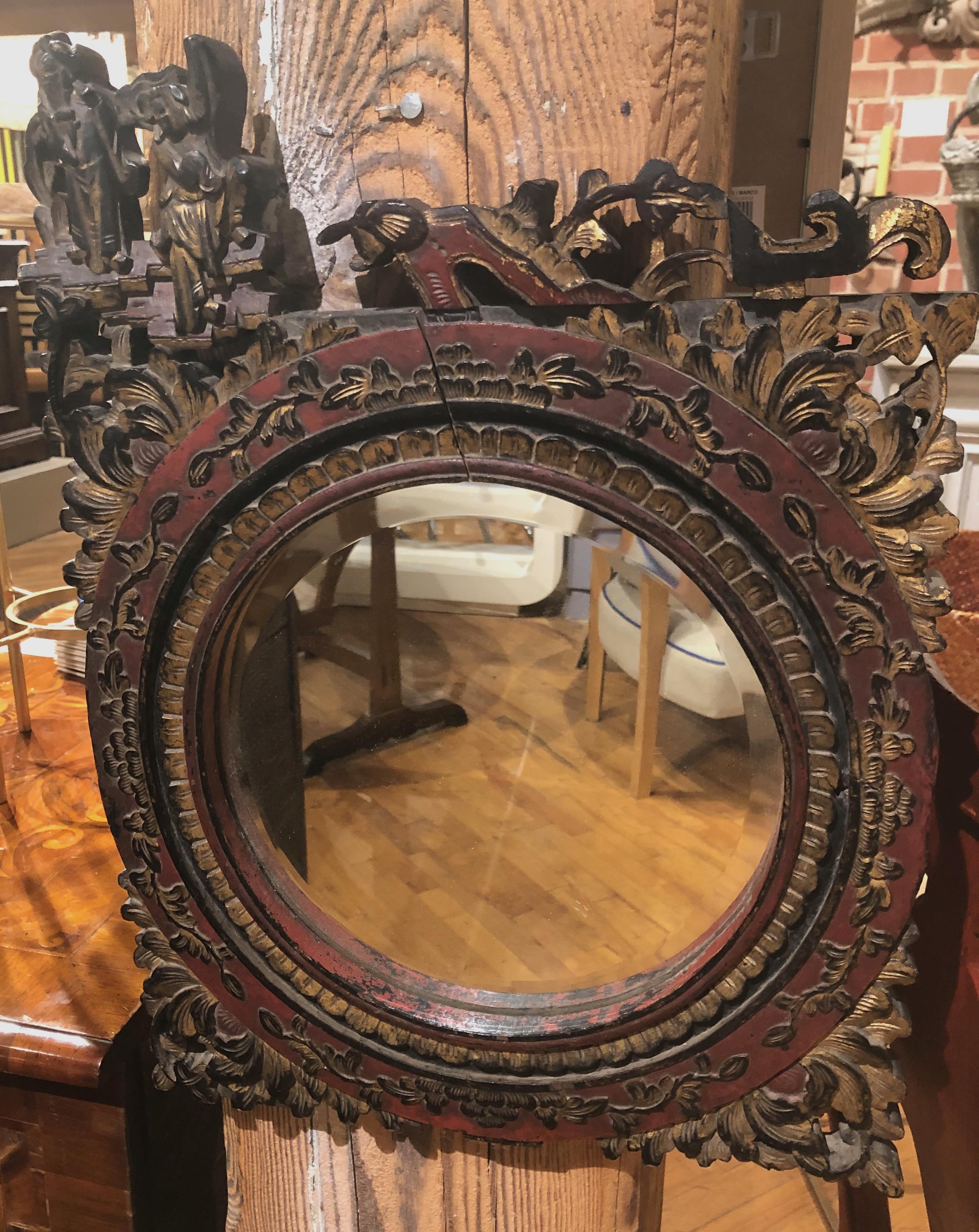 Small pair of late 19th century intricately carved Chinese mirrors with gilded black and red lacquered finish. Lovely for small rooms or hallways.
China, 1890.
Measure: 20” H 15” W.