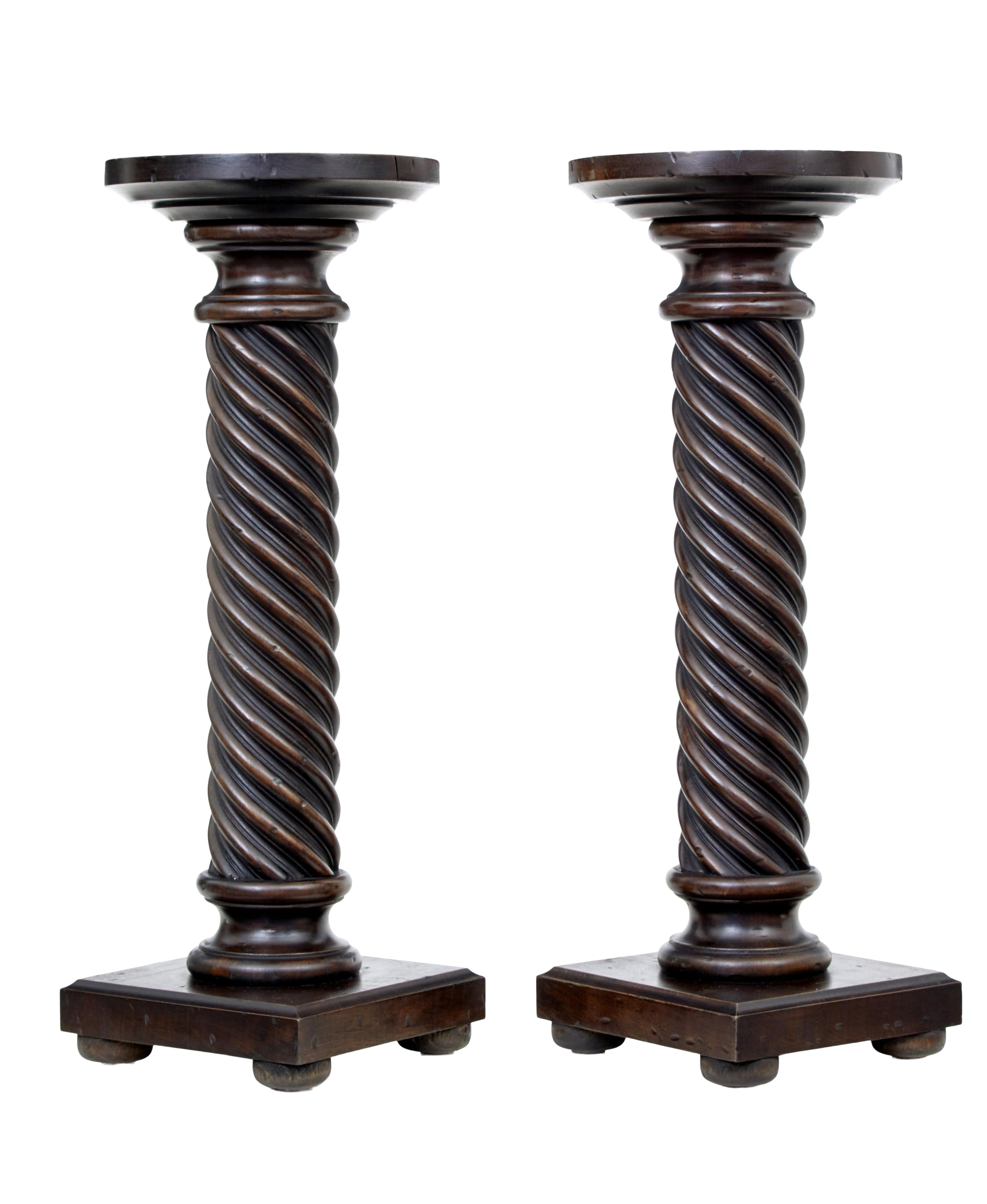Small pair of late 19th century mahogany barley twist columns, circa 1890.

Good quality pair of pedestals, circular 10 inch diameter with twisting column linking down to a square base.

Surface marks to top surface and base.

Top diameter: