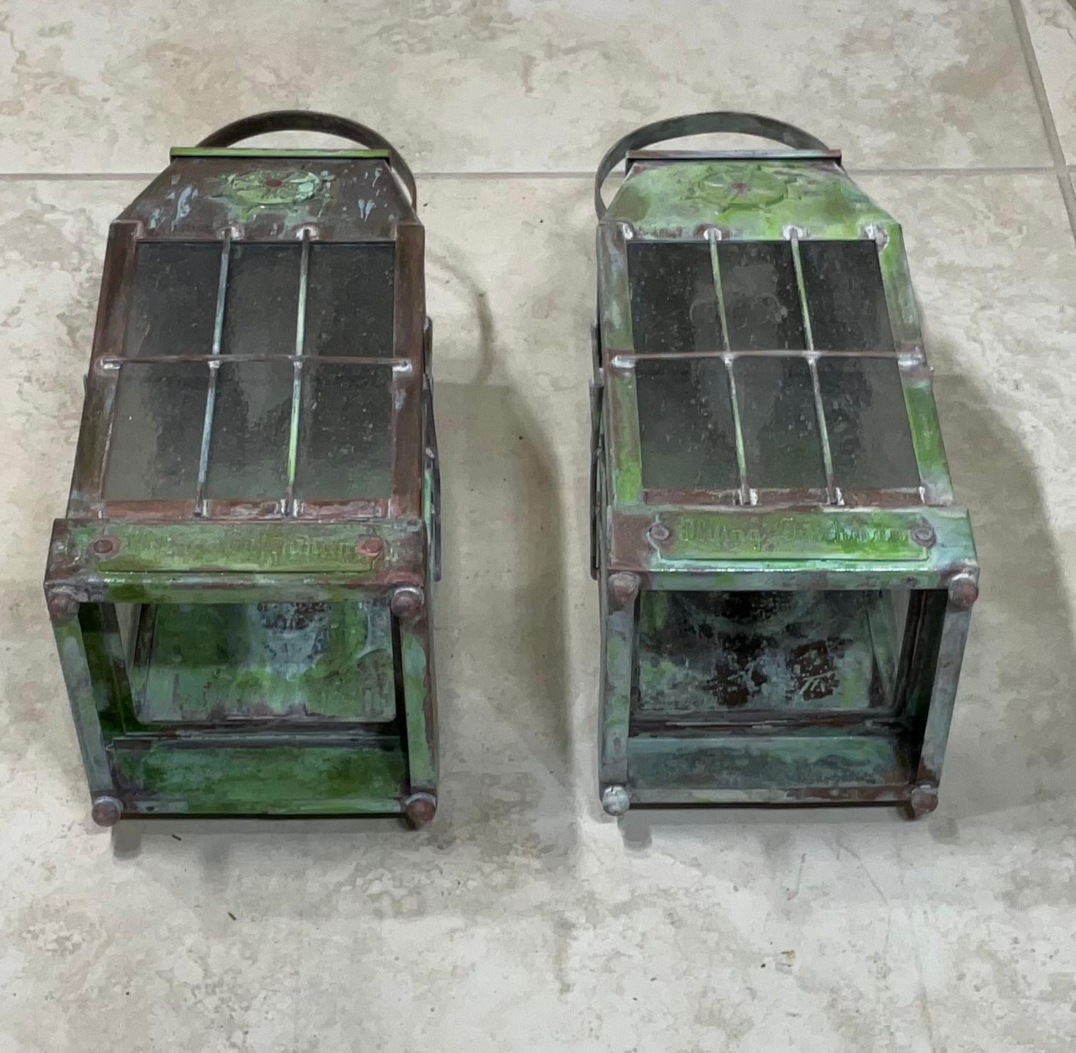Beautiful pair of wall lantern made of solid brass, exceptional quality workmanship, electrified with one 60/watt light each, seeded glass.
Protective decorative bars, very nice patina.
Suitable for wet location.
Will look good in beach house,