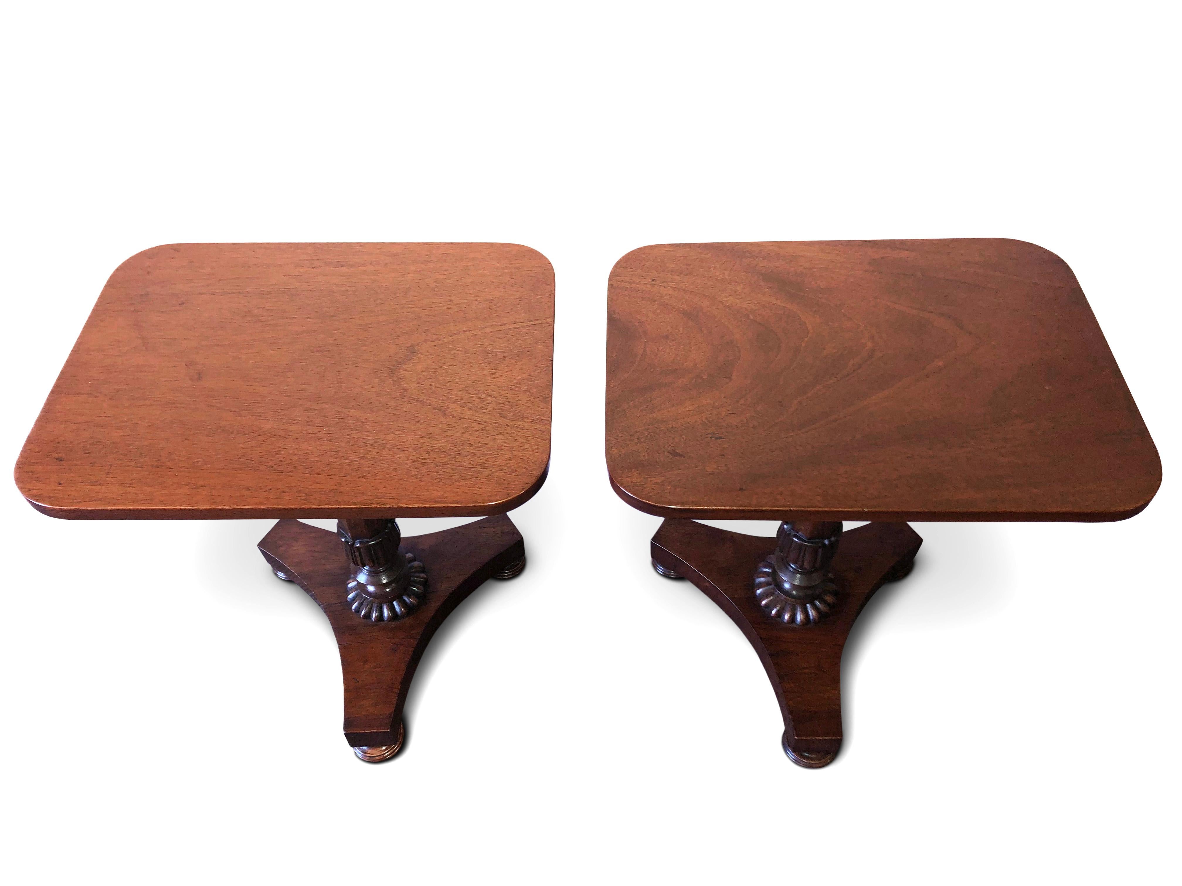 An unusual small pair of William IV wide tables, circa 1835
Rectangular tops, hexagonal Columns with gadrooned collars, resting on triform bases with bun feet.

(Probably adapted in height).