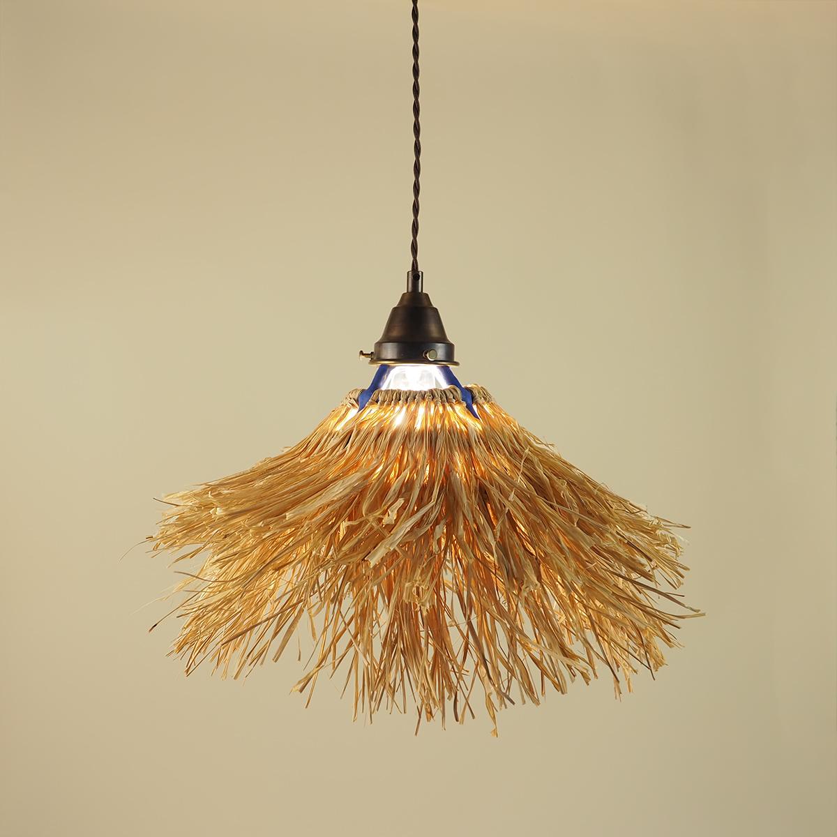 Inspired by warm summer nights under a palapa, this pendant light fixture plays with structure, organic textures, and the duality of perception.

The cage-like frame is hand built with speckled clay body coils and glazed in a matte blue glaze.