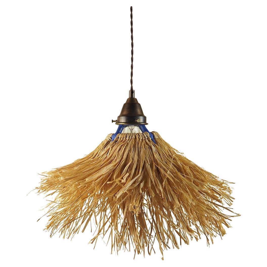 Petit pendentif Palapa de Nani Goods  Pendentif en céramique et raphia