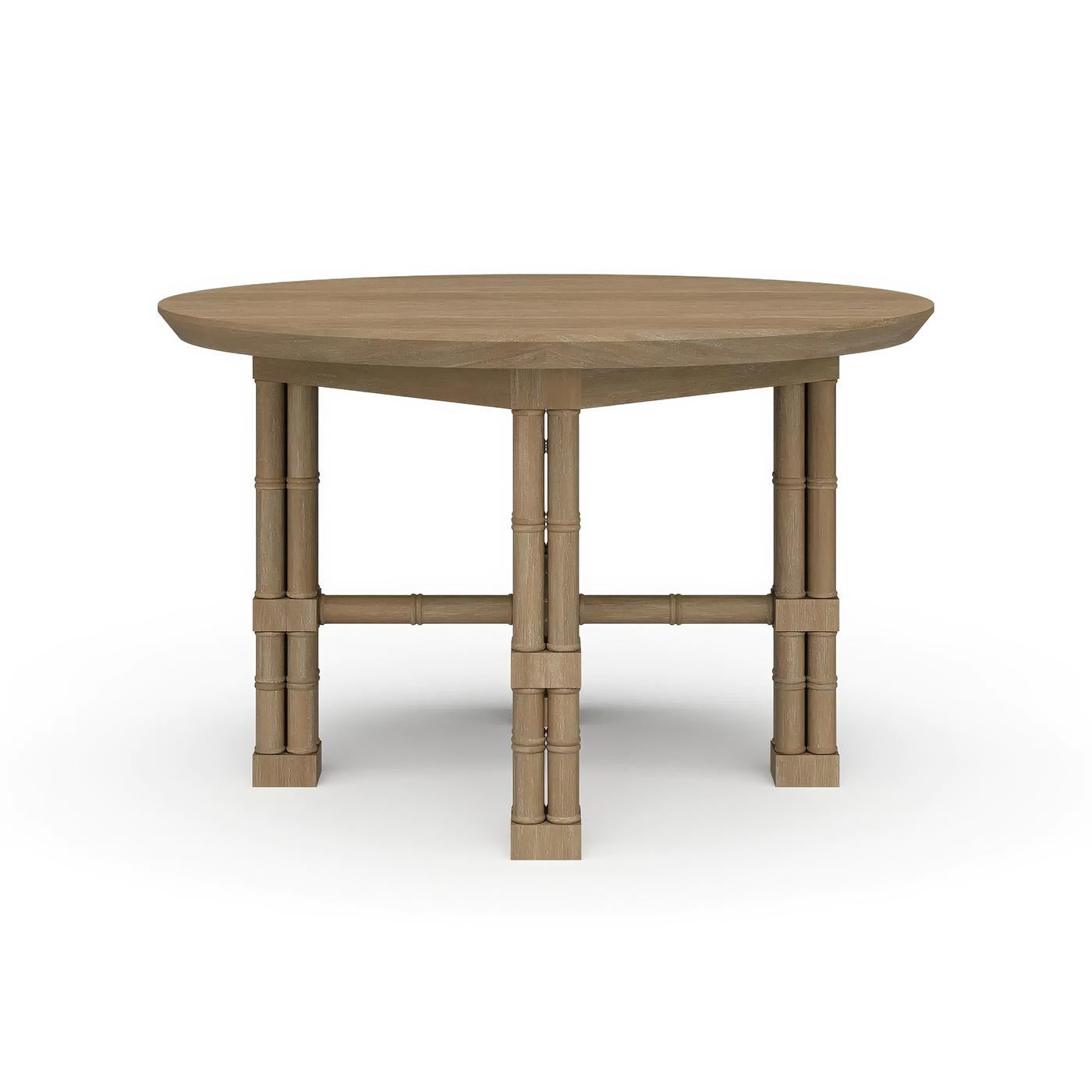 Hand-carved from mahogany and shown in our natural sandbar finish, this statement table features faux bamboo legs in the form of classic English cluster columns, joined by an X-form stretcher that adds both stability and architectural flair.

The