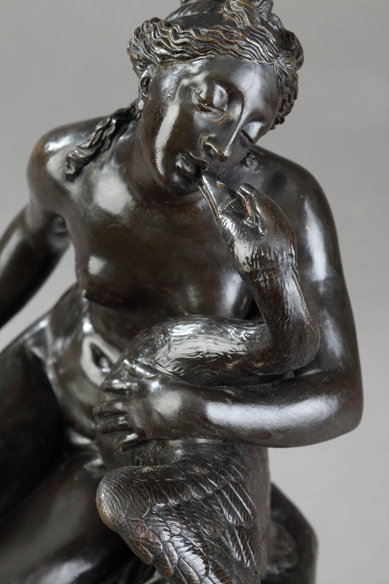 Early 19th century bronze mythological group featuring a love-making scene with a nude seated Leda cuddling the Swan. In Greek mythology, Leda was admired by Zeus, who seduced her in the guise of a swan. As a swan, he fell into her arms for