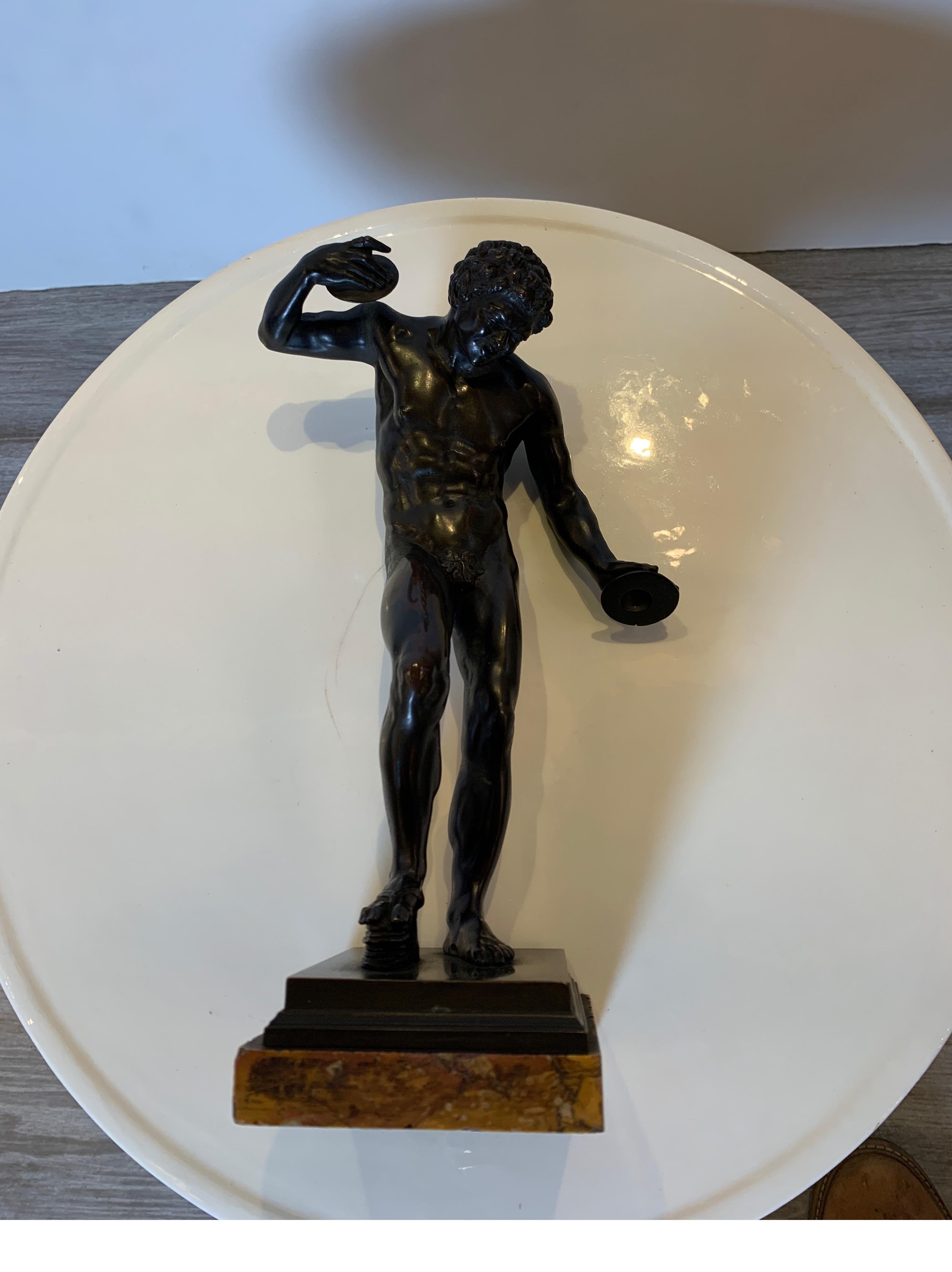 An antique 19th century Grand Tour bronze figure of pan. The figure with original finish with some oxidation at the joint on the arm. The bronze on sienna marble base.