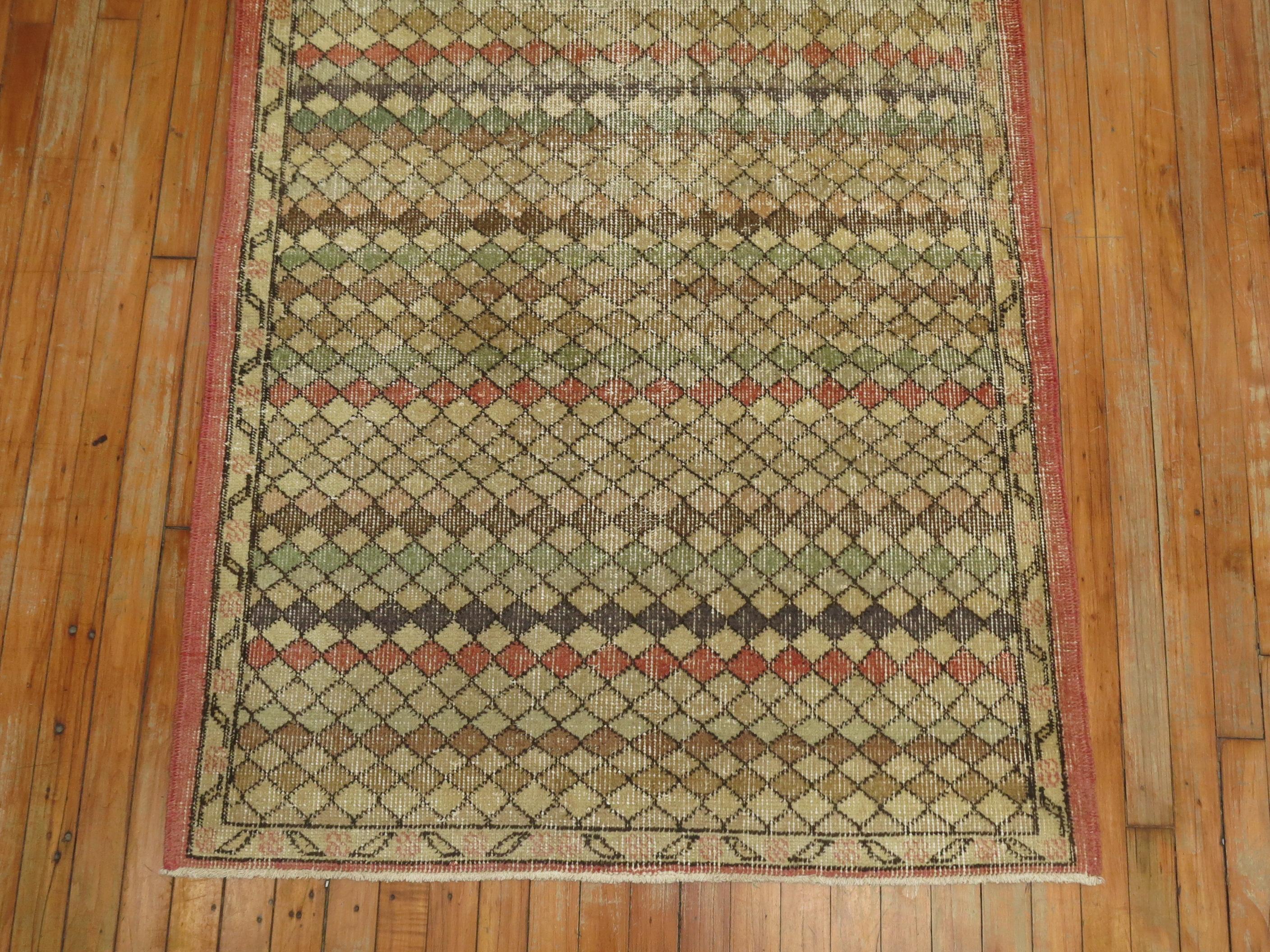Turkish deco small runner with faded predominant accents in rose, brown green, circa mid-20th century.

Measures: 3'6