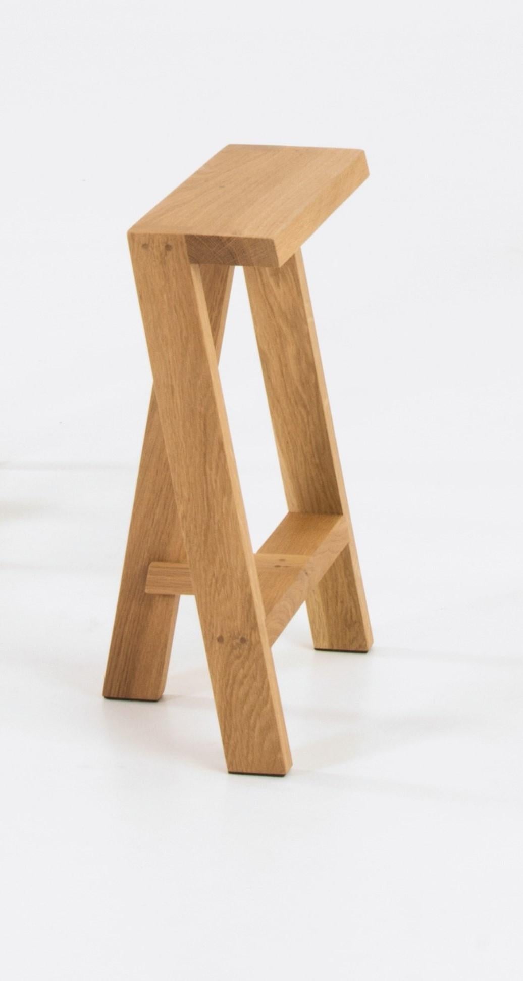 Small Pausa oak stool by Pierre-Emmanuel Vandeputte
Dimensions: D 20 x W 35 x H 45 cm
Materials: oak wood
Available in burnt oak version and in 3 sizes.

Pausa is a series of stools; 45cm, 65cm, or 80cm of assembled oak pieces. 
The narrow