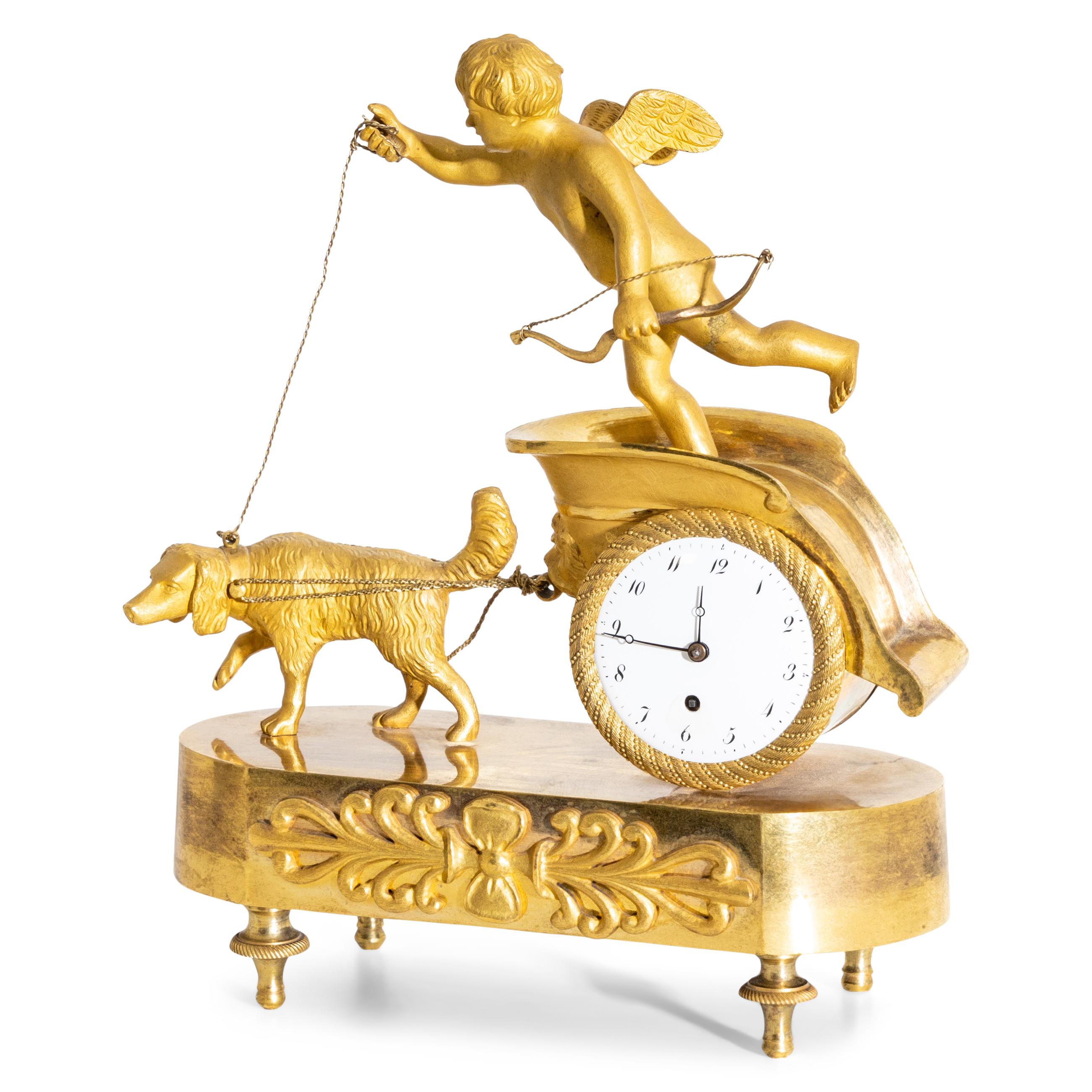 Small fire-gilded bronze pendule with cupid on a chariot drawn by a single dog. Enamel clockface with Arabic numerals. Movement signed Paillard à Paris, No. 545.