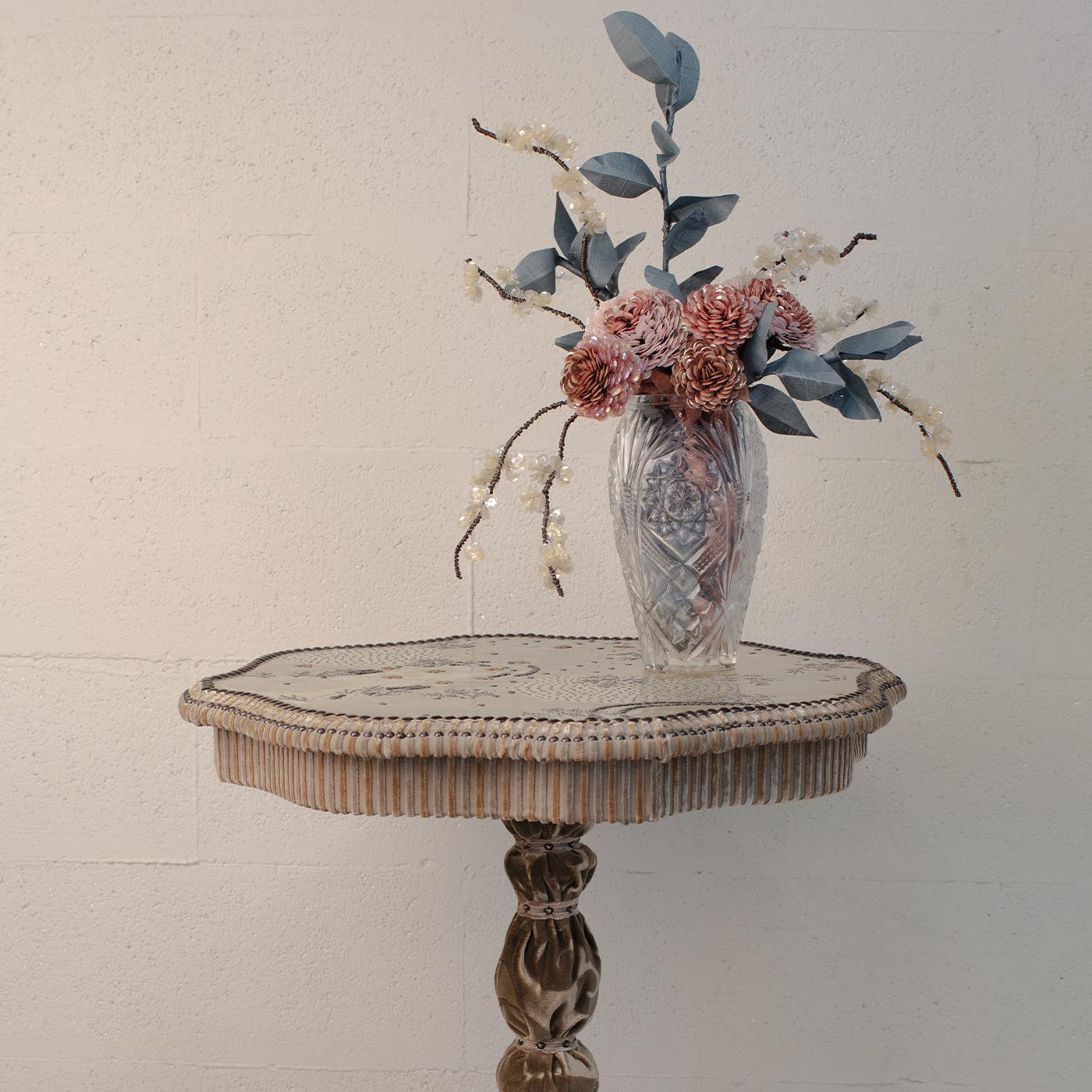 Created entirely by hand using remnants of fabric collected by Valentina Giovando, sequins and iron as supporting material, this fabulous floral arrangement includes leafy branches, white blossoms and red hydrangea in a vintage glass vase. Each