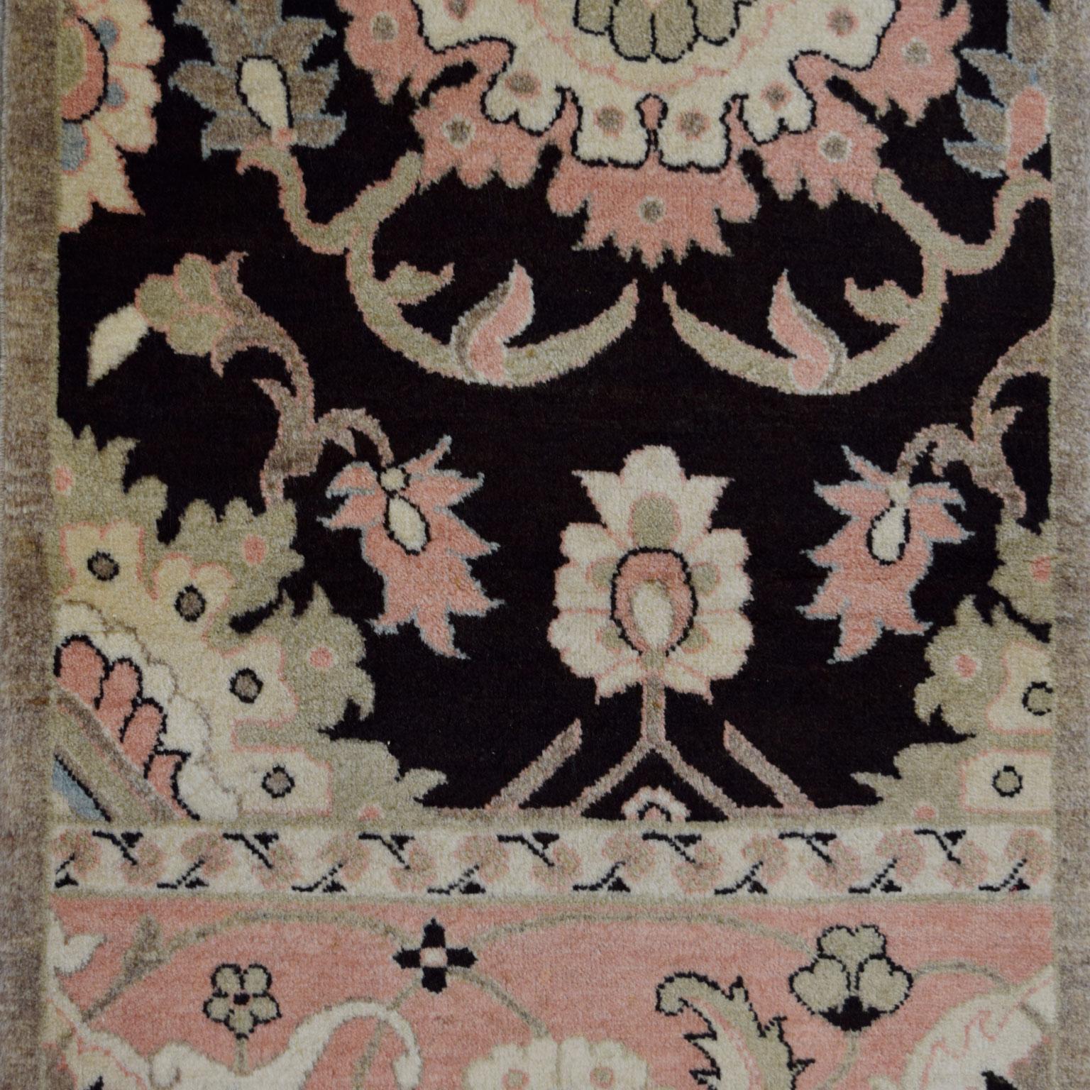 This mini Persian Farahan carpet measures 2'2