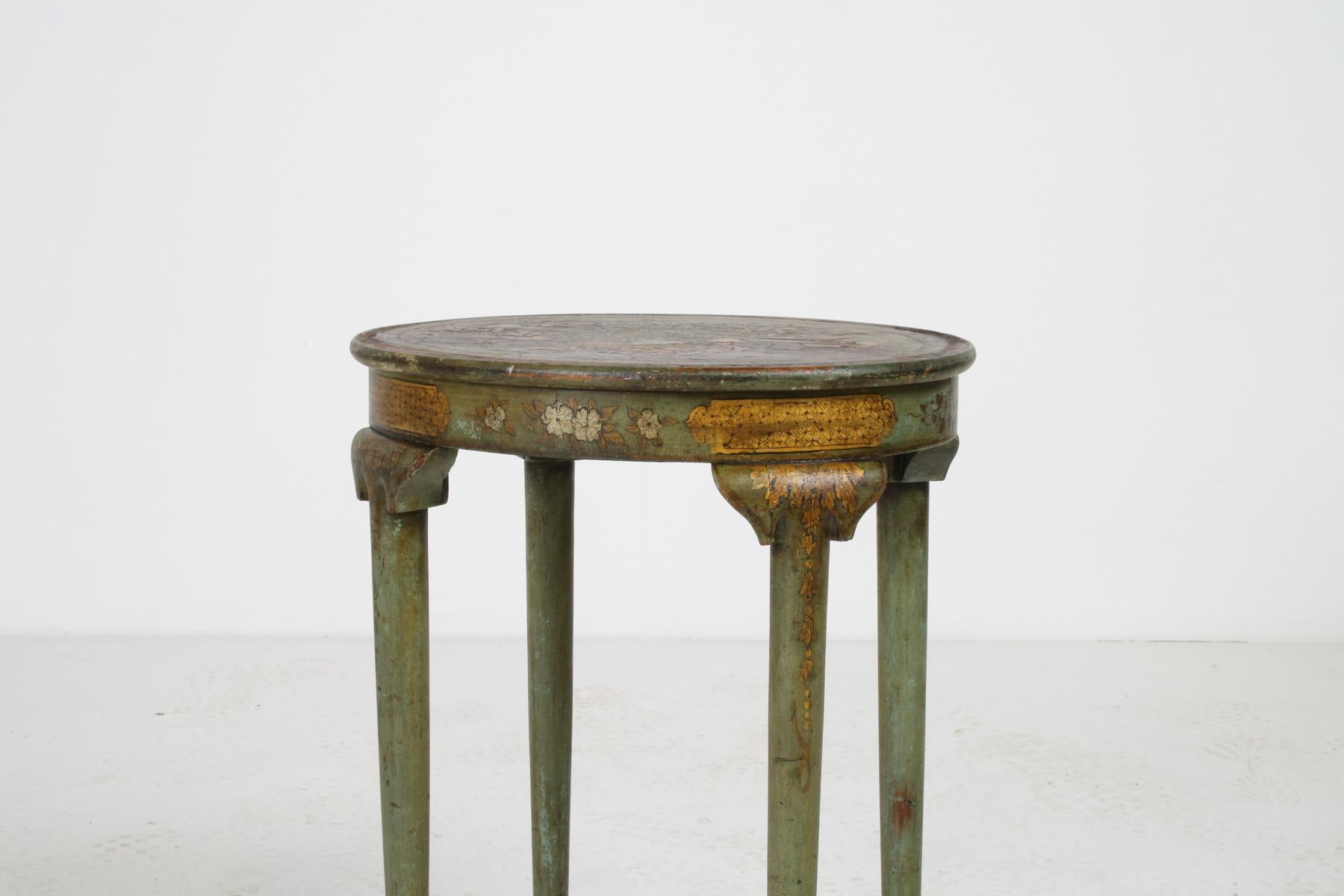 This charming antique side table features a beautifully crafted chinoiserie design with a lovely green finish. The oval-shaped top sits atop tapered legs that terminate in delicate pad feet, giving the table a graceful, sophisticated silhouette.
The