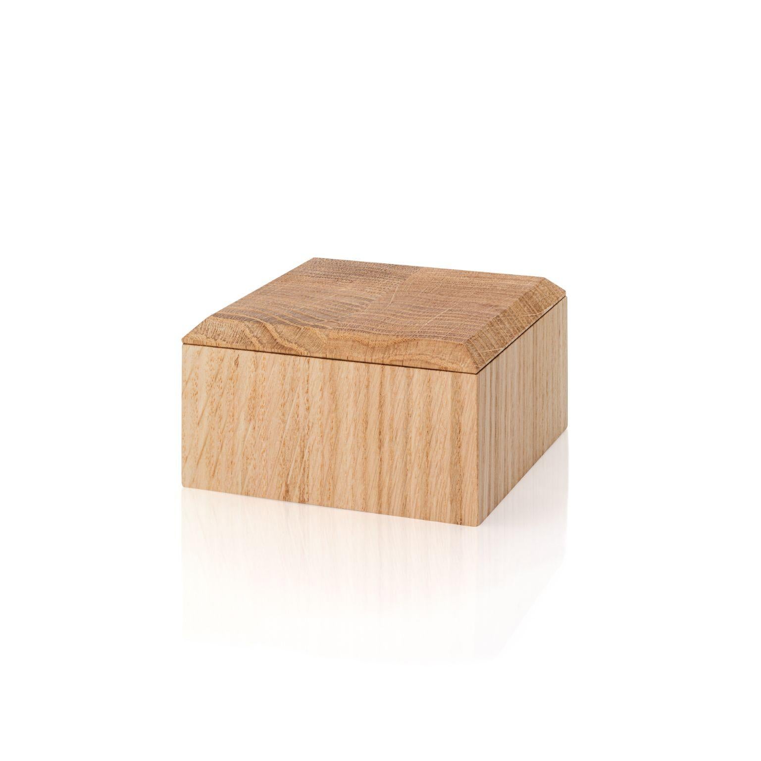Small Pino boxes by Antrei Hartikainen.
Materials: Oak, natural oil wax.
Dimensions: W 18 / 14, D 9, H 5 / 7cm.

A set of three vertical and two horizontal stacking boxes constructed of vividly grained woods. The pino boxes may be arranged in