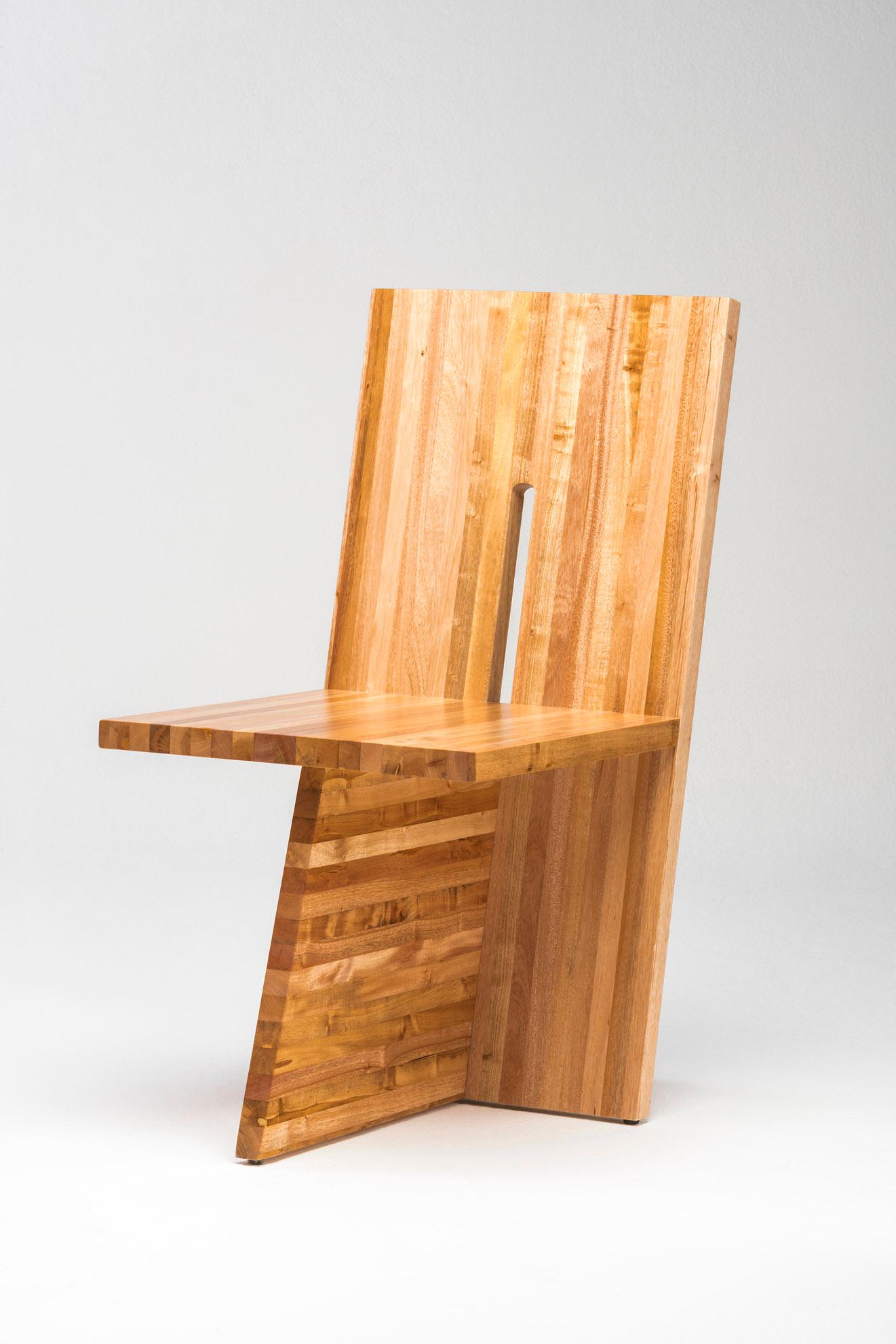 Contemporary chair by Juliana Lima Vasconcellos made in Solid African mahogany wood panel, with and architectural aesthetic formed by embedded planes that create an image of simplicity and balance.