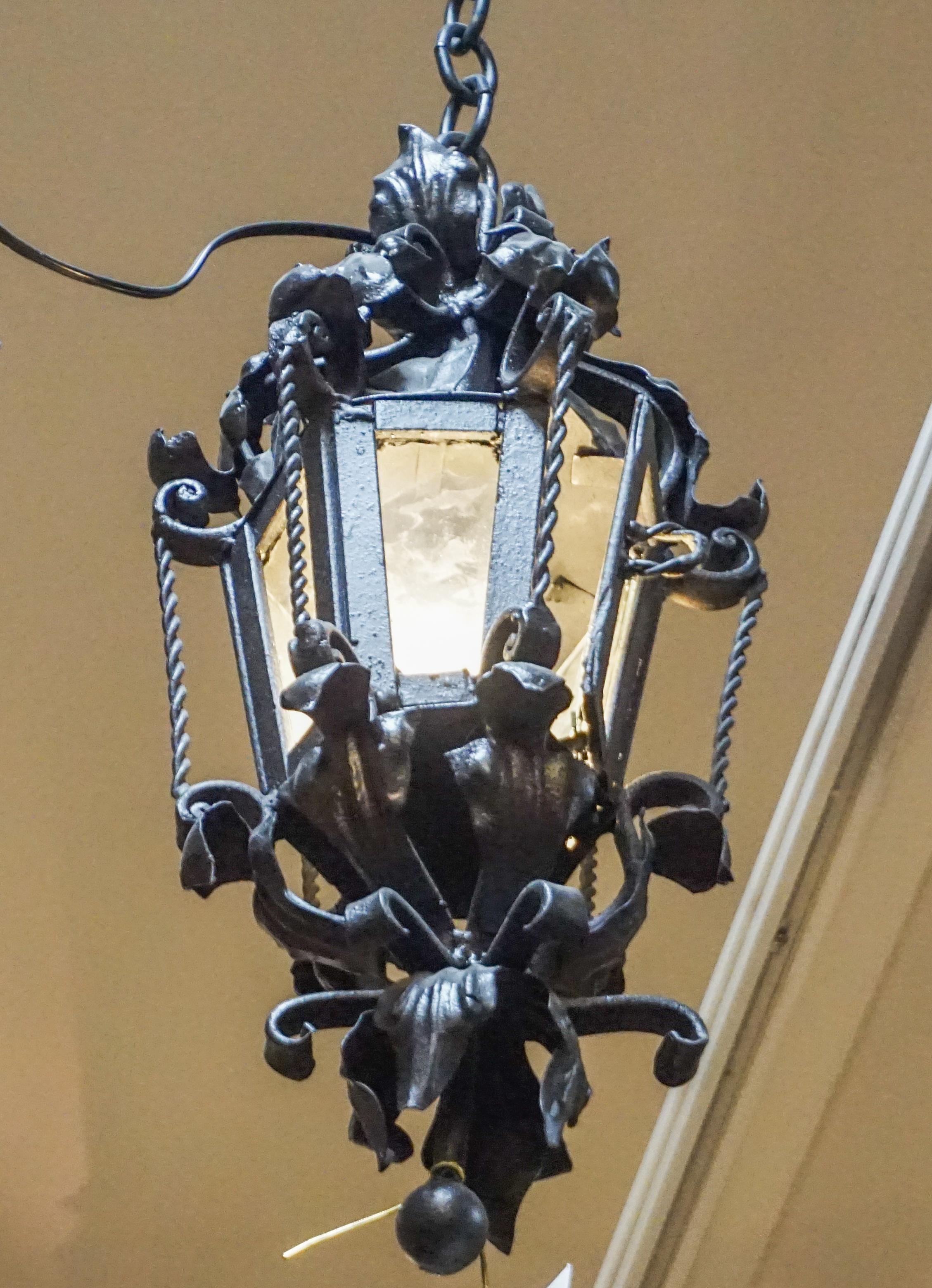 This small iron porch lantern originates from France and is wired, ready for install. 

Measurements: 9