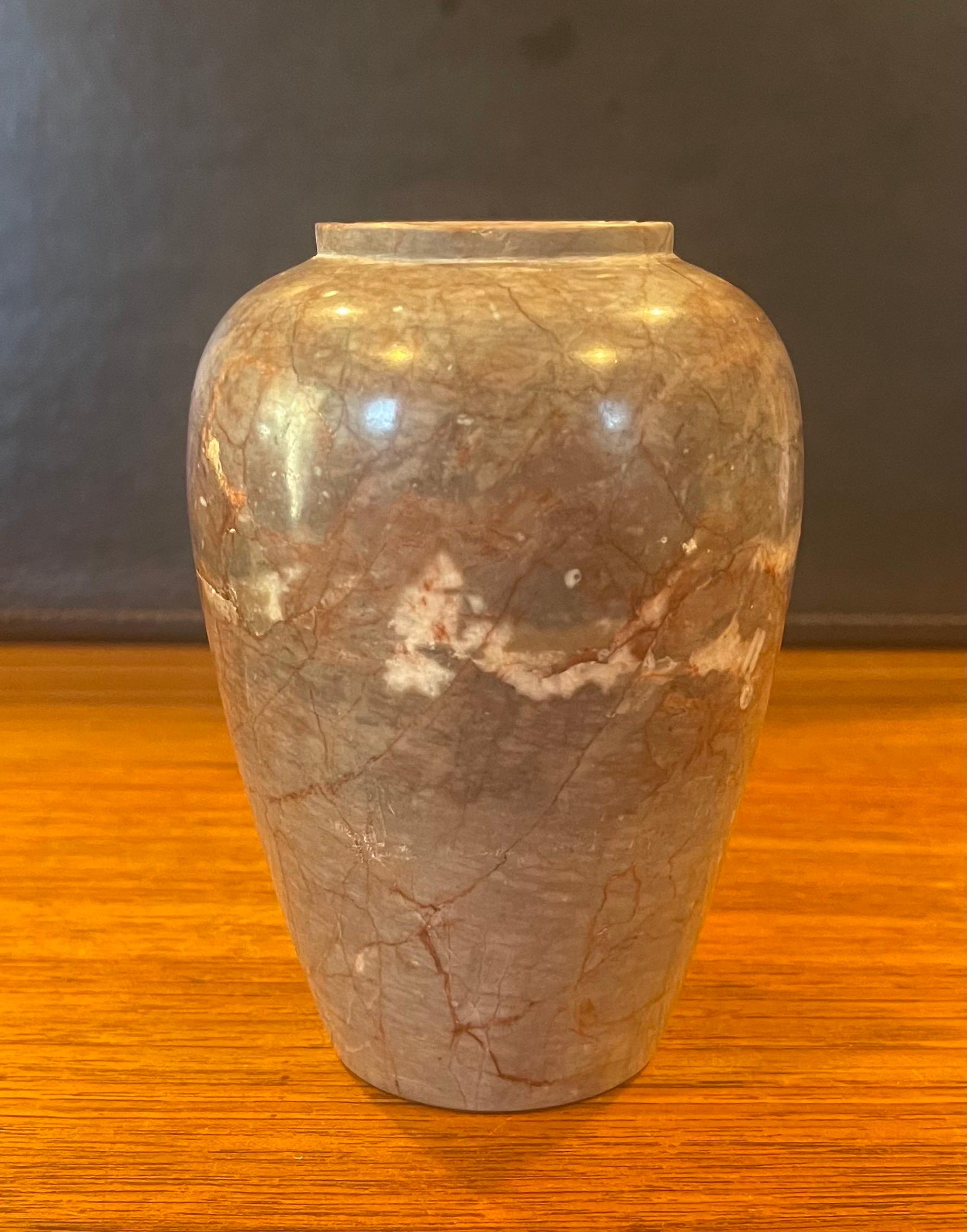 Small post-modern Italian marble vase, circa 1970s. The vase is primarily a dark tan in color, but has cream, black and red veining throughout. The vase is in very good vintage condition with one minor chip on the top ring and measures 3.5