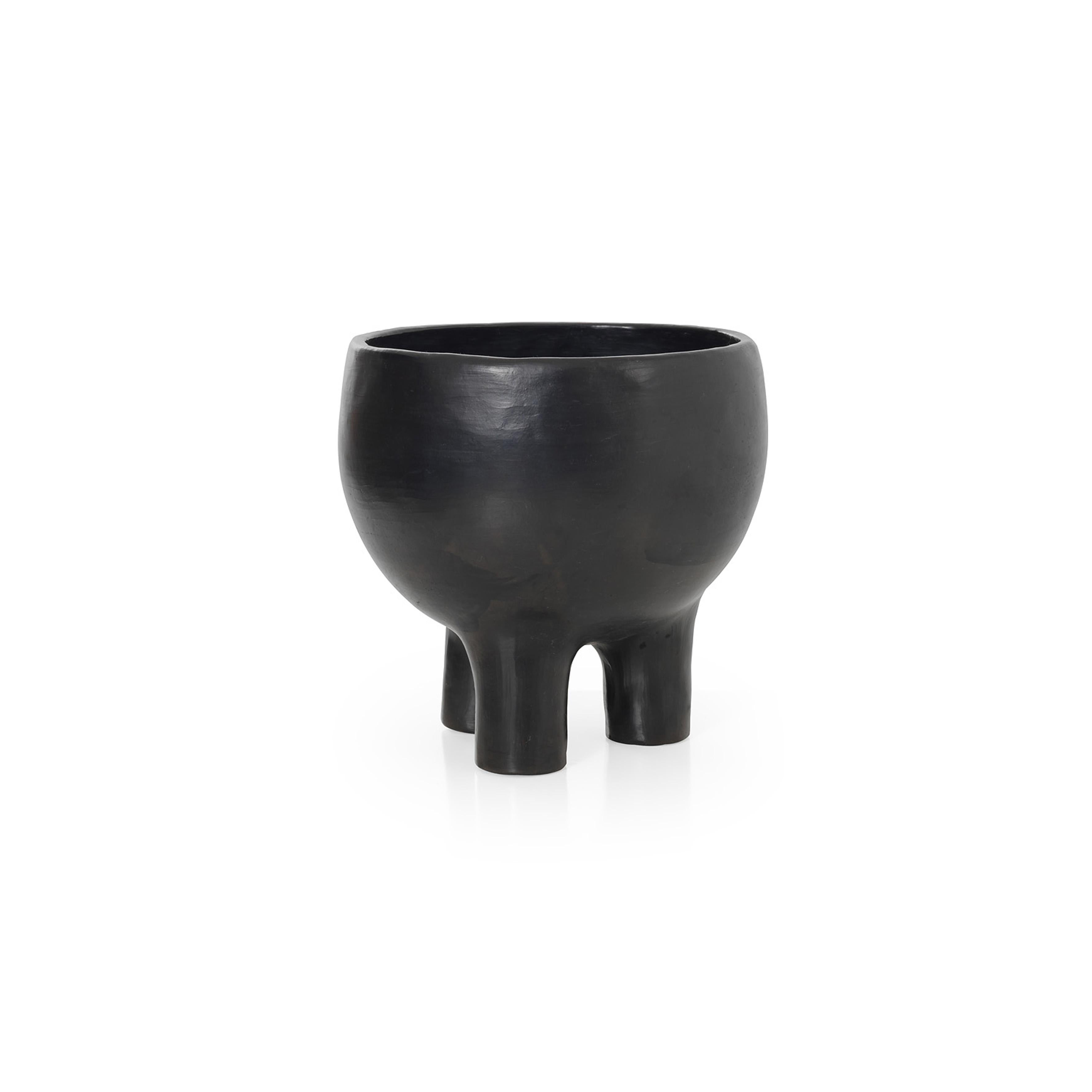 Small pot 2 by Sebastian Herkner
Materials: Heat-resistant black ceramic. 
Technique: Glazed. Oven cooked and polished with semi-precious stones. 
Dimensions: Diameter 30 cm x height 30 cm 
Available in sizes large and mini.

This pot belongs