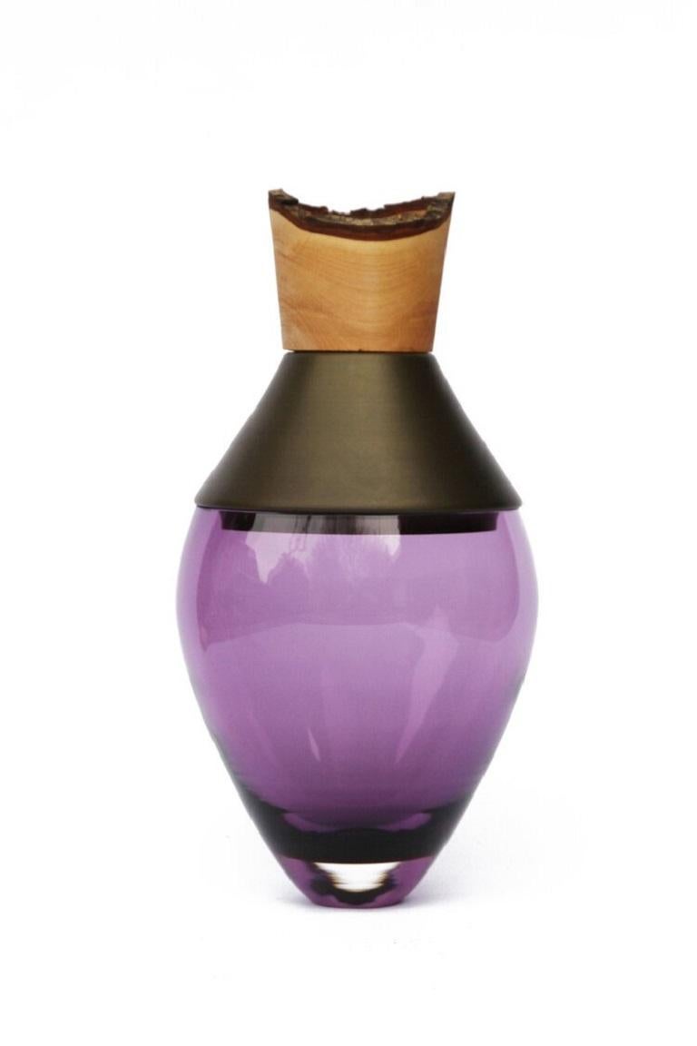 Small purple and brass patina India Vessel I, Pia Wüstenberg
Dimensions: D 15 x H 30
Materials: glass, wood, brass patina
Available in other metals: brass, copper, brass patina, copper patina, rust

Handmade in Europe, by individual craftsmen: