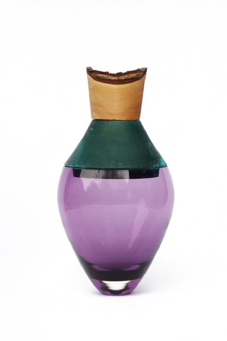 Small purple and copper patina India vessel I, Pia Wüstenberg
Dimensions: D 15 x H 30
Materials: glass, wood, copper patina
Available in other metals: brass, copper, brass patina, copper patina, rust

Handmade in Europe, by individual