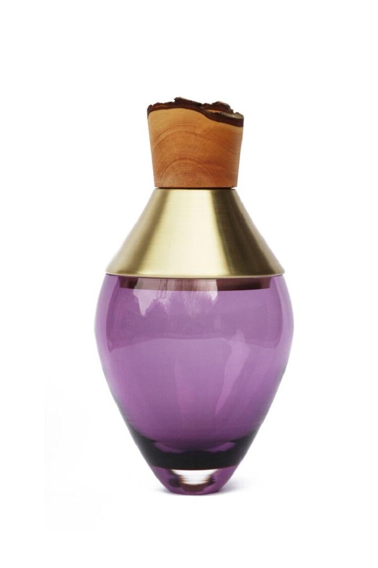 Small Purple India Vessel I, Pia Wüstenberg
Dimensions: D 15 x H 30
Materials: glass, wood, metal
Available in other metals: brass, copper, brass patina, copper patina, rust

Handmade in Europe, by individual craftsmen: handblown glass (Czech